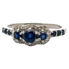 Sterling Silver Blue Sapphire Three Stone Diamond Halo Engagement Ring