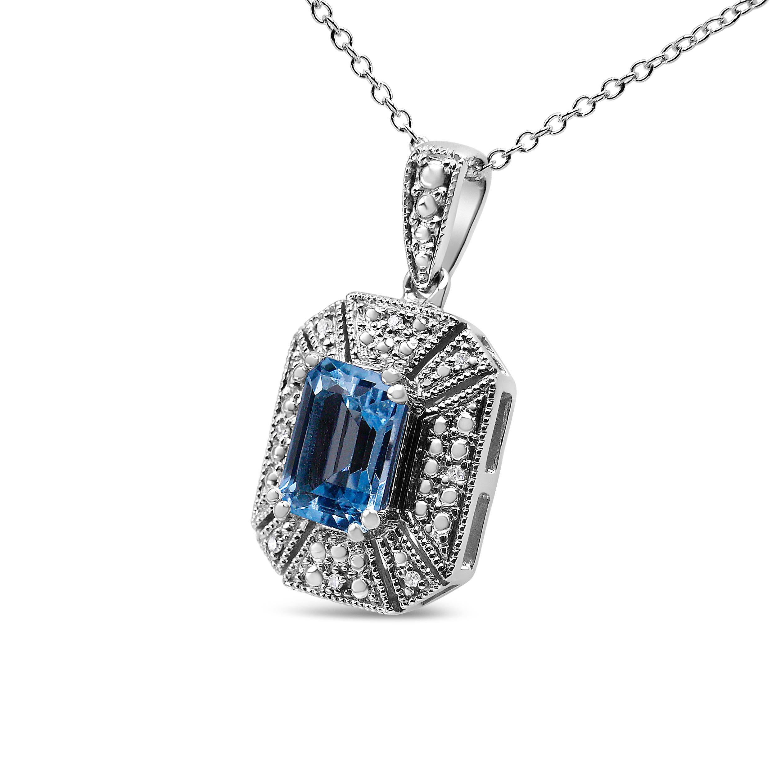 This Art Deco-inspired pendant necklace is made to make a statement. The .925 Sterling Silver necklace features an intricate design in an alluring emerald shape, accented with a rich 8x6mm emerald-cut natural blue Topaz gemstone that adds that pop