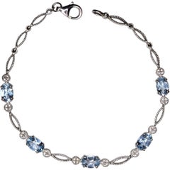 Sterling Silver Blue Topaz Link Bracelet with Marquise and Round Detailing