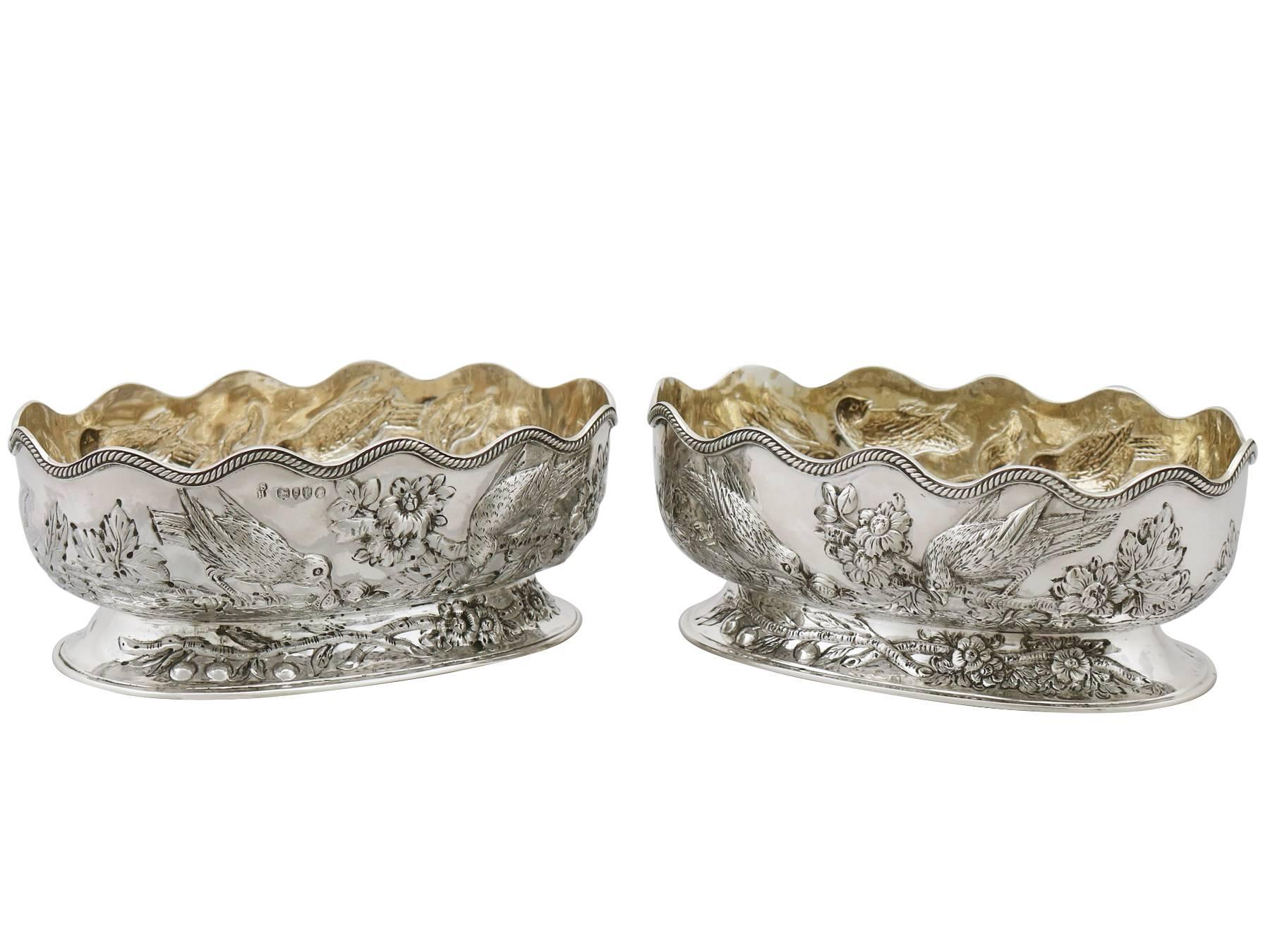 An exceptional, fine and impressive pair of antique Victorian English sterling silver bon bon dishes made by Charles Stuart Harris; part of our ornamental silverware collection

These exceptional antique Victorian English bon bon dishes in