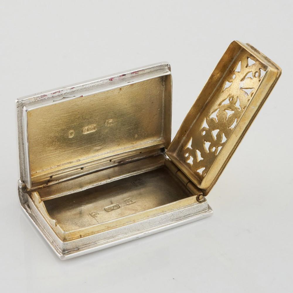 Heading : One
Date : Hallmarked in Birmingham in 1835 for Gervase Wheeler
Period : William IV
Origin : Birmingham, England
Decoration : In the form of a book with a naturalistic parcel gilt grille. Vacant cartouche
Size :  3.1x2x0.6cm
Condition :