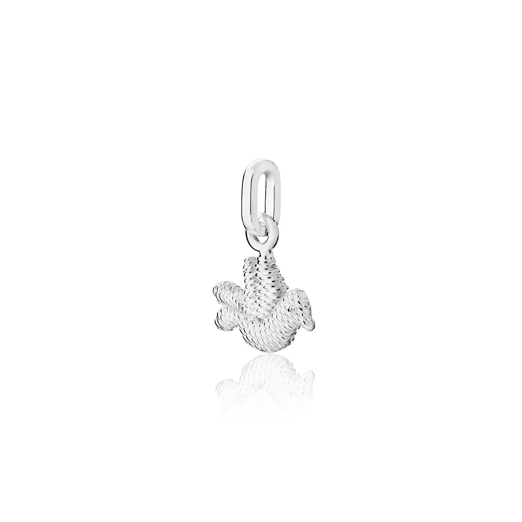 The Bordados Bird Charm from the Bordados Collection by TANE is handmade in sterling silver by TANE's expert artisans in Mexico. Its bird shape recreates in silver the original embroidery created by the artisans of San Antonino Castillo Velasco,