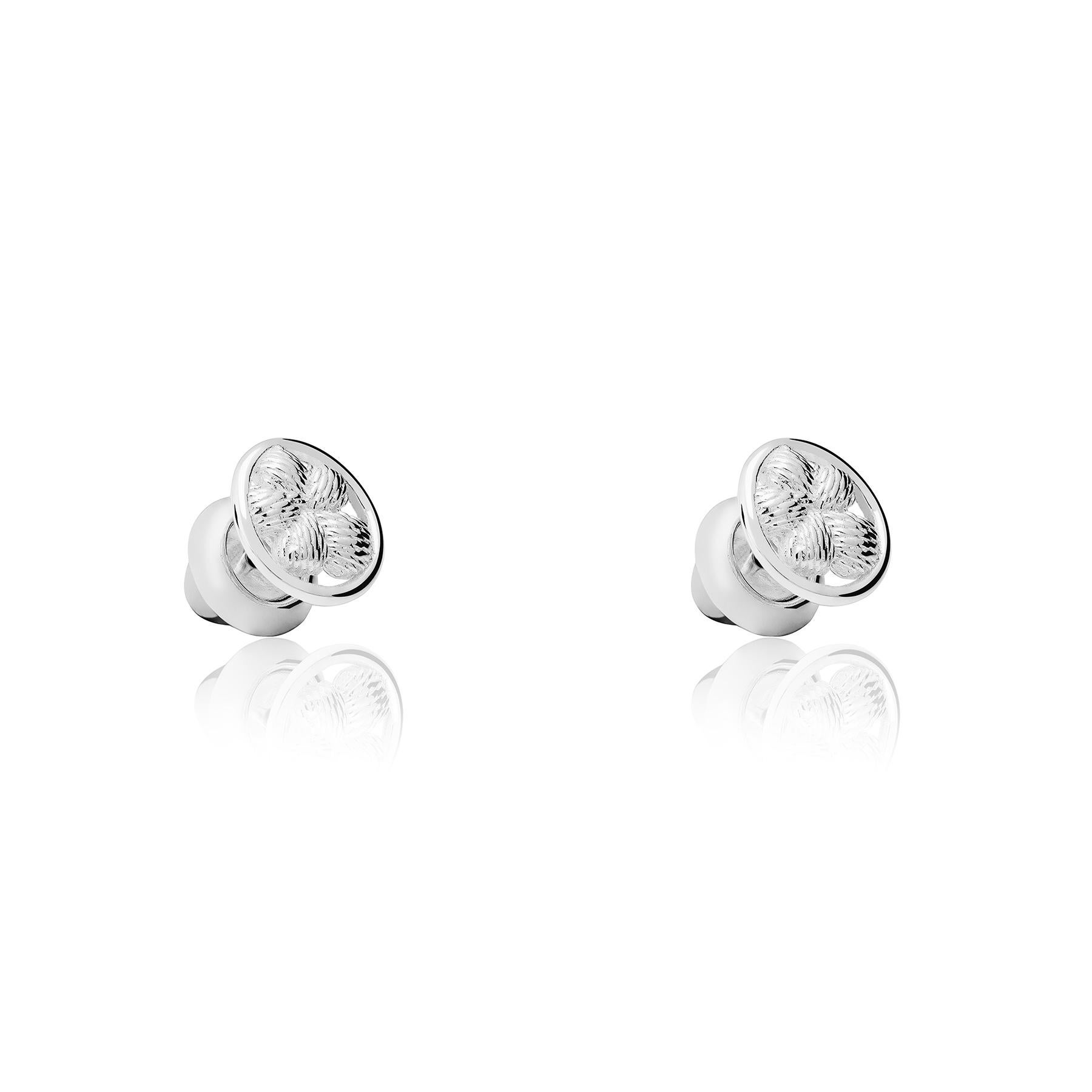 The Bordados Flower Button Earrings from the Bordados Collection by TANE are handmade in sterling silver by TANE's expert artisans in Mexico. The button silhouette frames a flower whose texture recreates in silver the thread with which the original