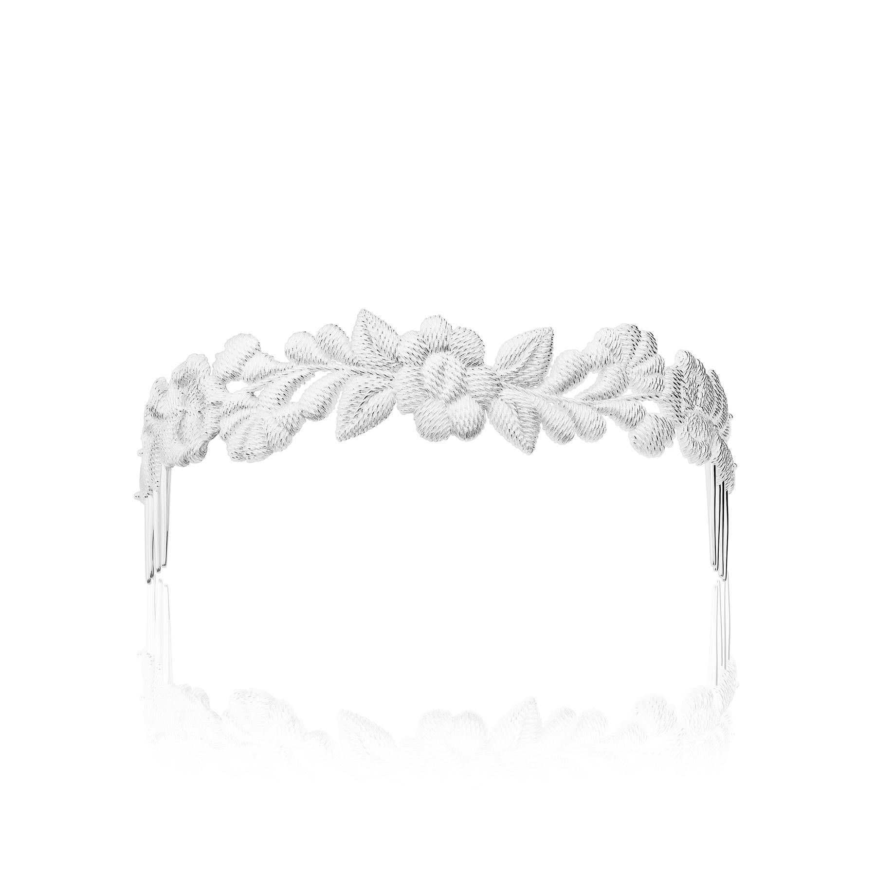 The Bordados Hair Comb from the Bordados Collection by TANE is handmade in sterling silver. The piece takes the original shapes and textures of one of the embroideries made for the collection and separates them from the textile that originally