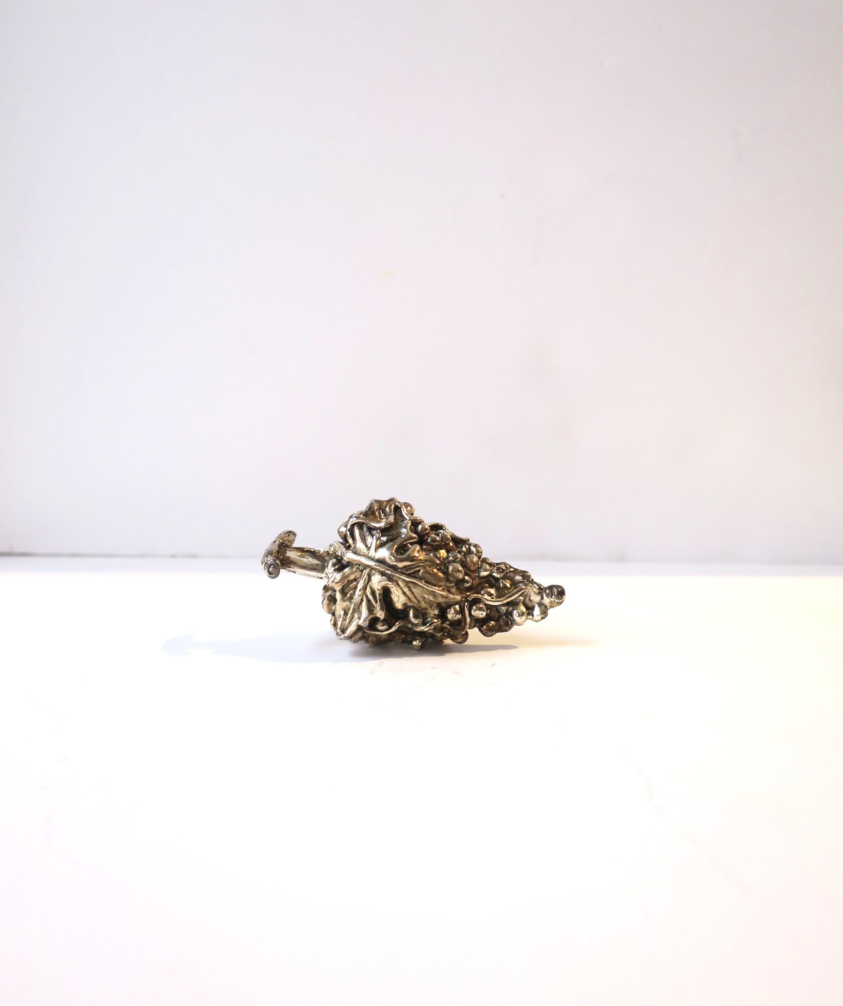 A beautiful sterling silver wine bottle stopper, handcrafted of grapes, vines, and leaves, circa mid to late-20th century. This sterling silver piece was hand sculpted by a master artisan. Marked '925' for sterling silver on inside as shown in last