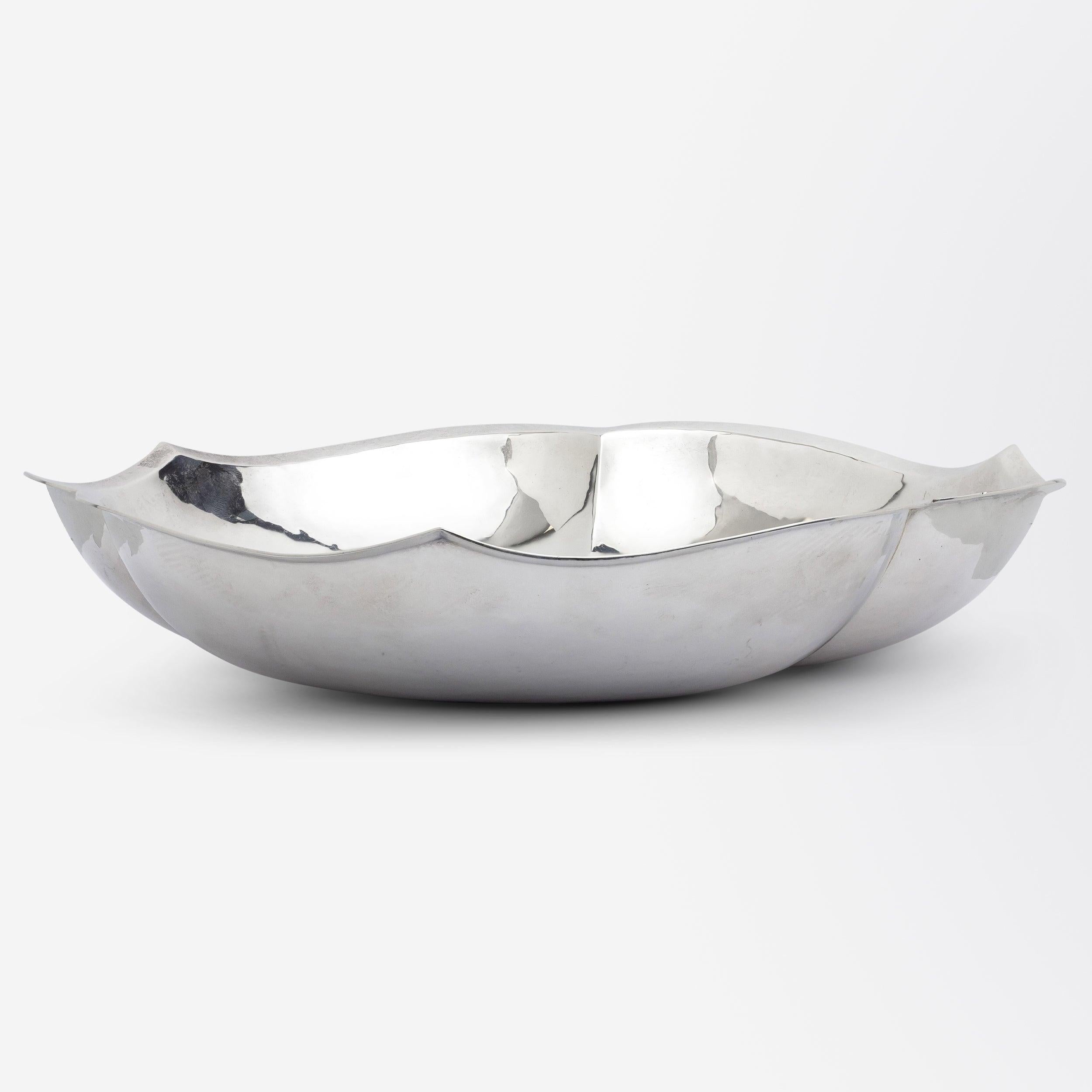 This delightful sterling silver centrepiece bowl was manufactured by the Chicago based 'Cellini Crafts' likely in the late 1930s. The handwrought piece features three pointed 'lobes' and would have likely been intended to be a serving piece or to be
