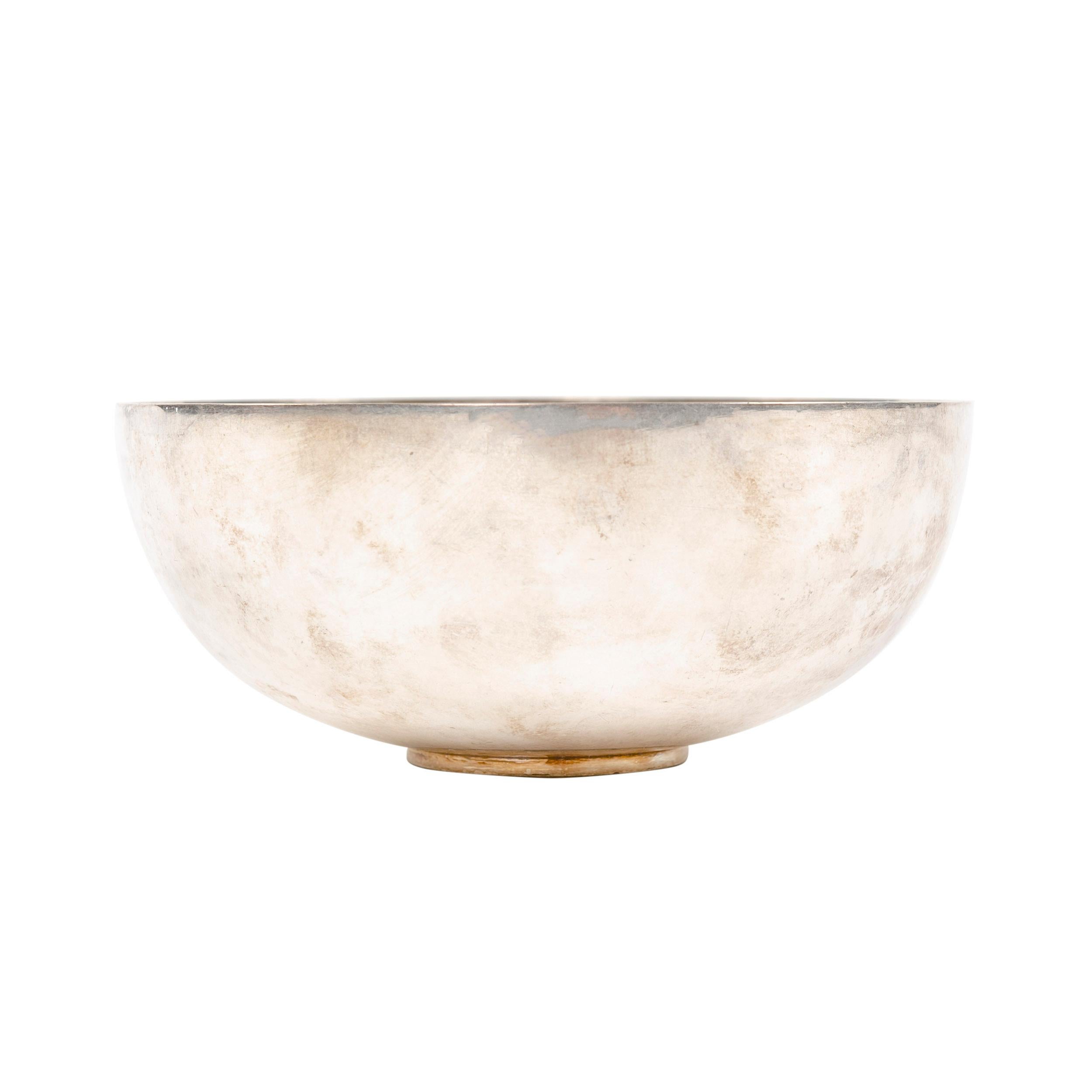 A small Scandinavian Modern sterling silver bowl designed by Piet Hein. Bowl is stamped '1145 B' on its base. Manufactured by Georg Jensen in Denmark, 1960s.
