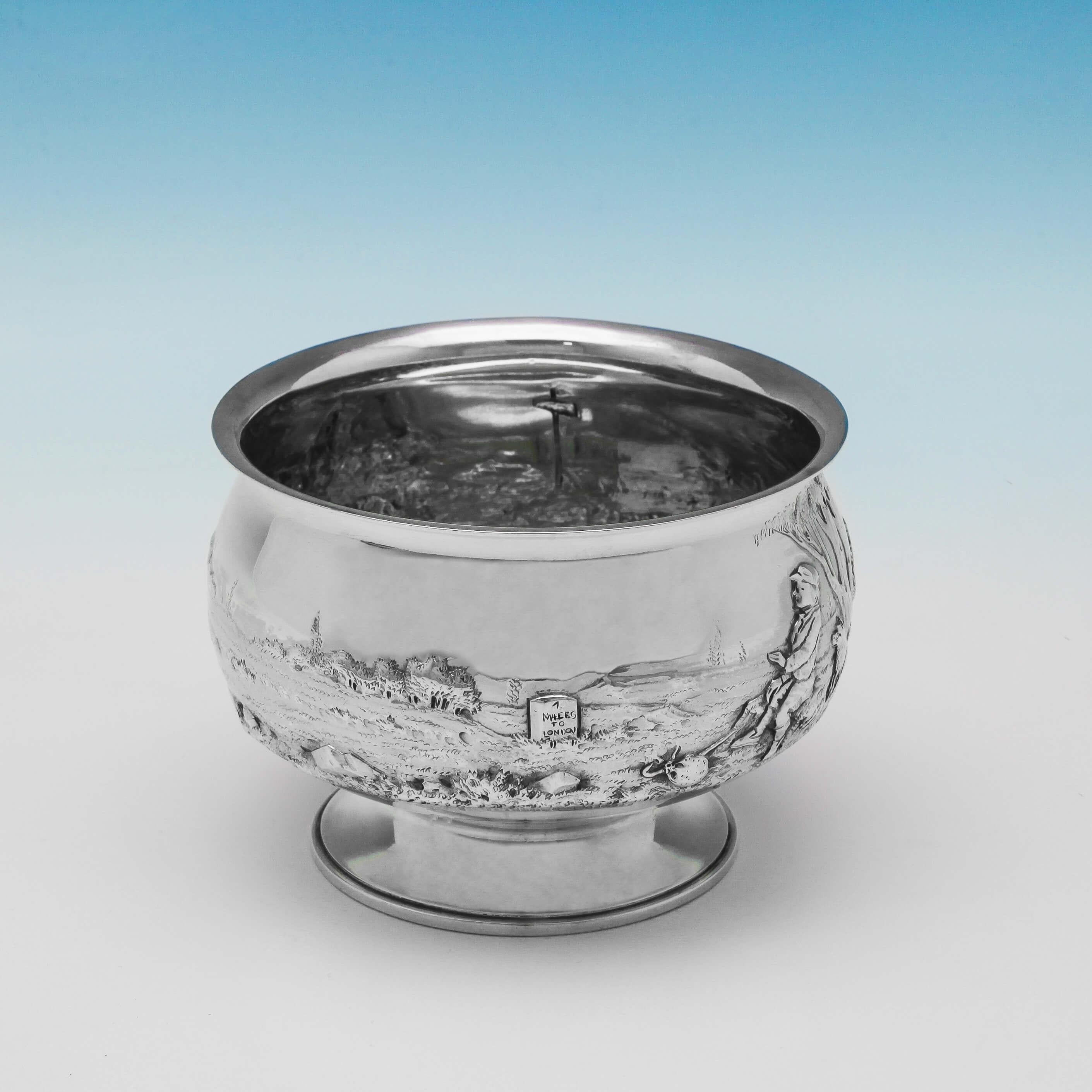 Hallmarked in London in 1908 by Holland, Aldwinckle & Slater, this charming Edwardian Antique, Sterling Silver Bowl, has a chased scene depicting Dick Whittington and his cat on their way to London. The bowl is 3