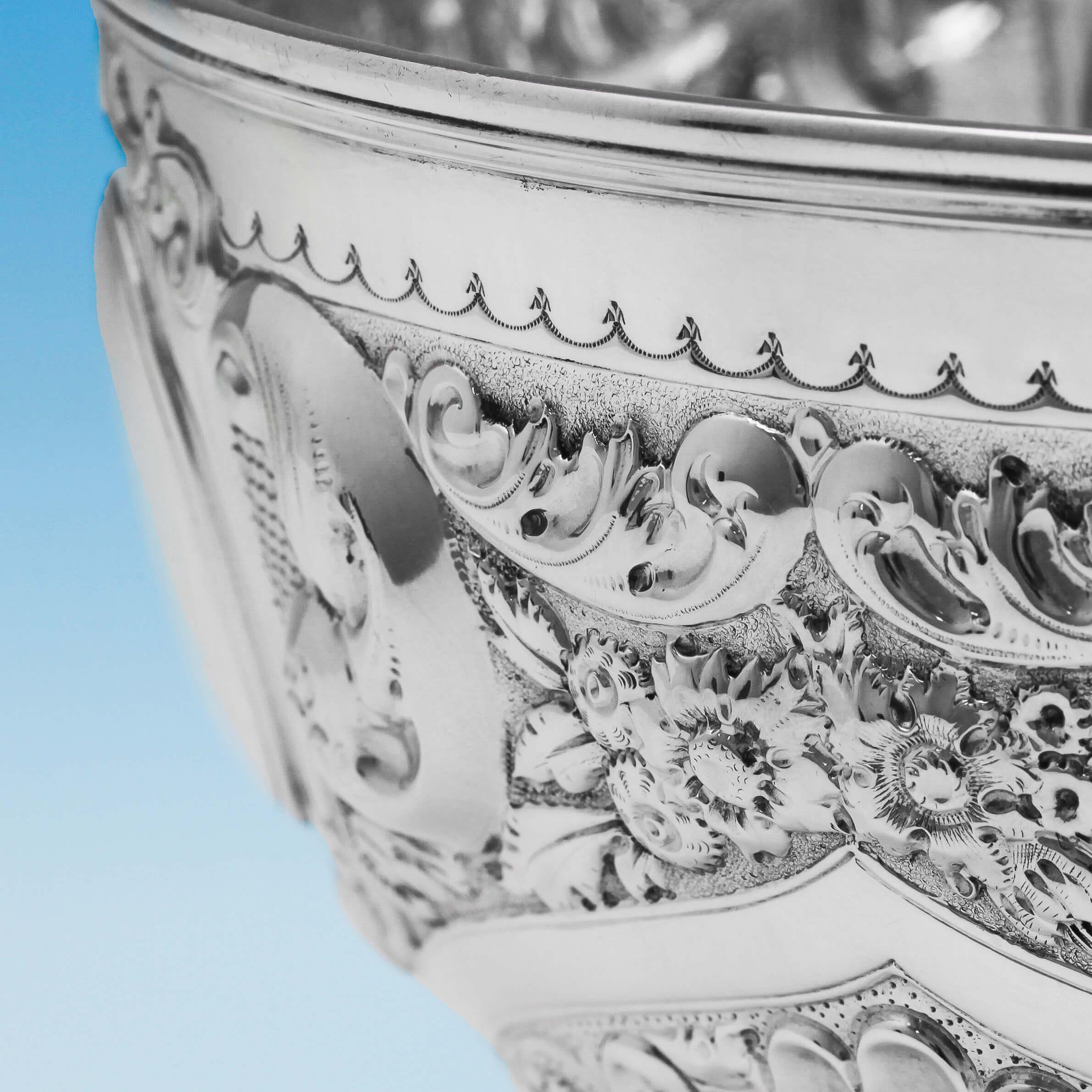 Hallmarked in London, 1898 by Jackson & Fullerton, this attractive, Victorian, antique, sterling silver bowl, stands on a pedestal foot, and features chased acanthus and floral decoration, and sunken swirled fluting. The bowl measures: 6 inches