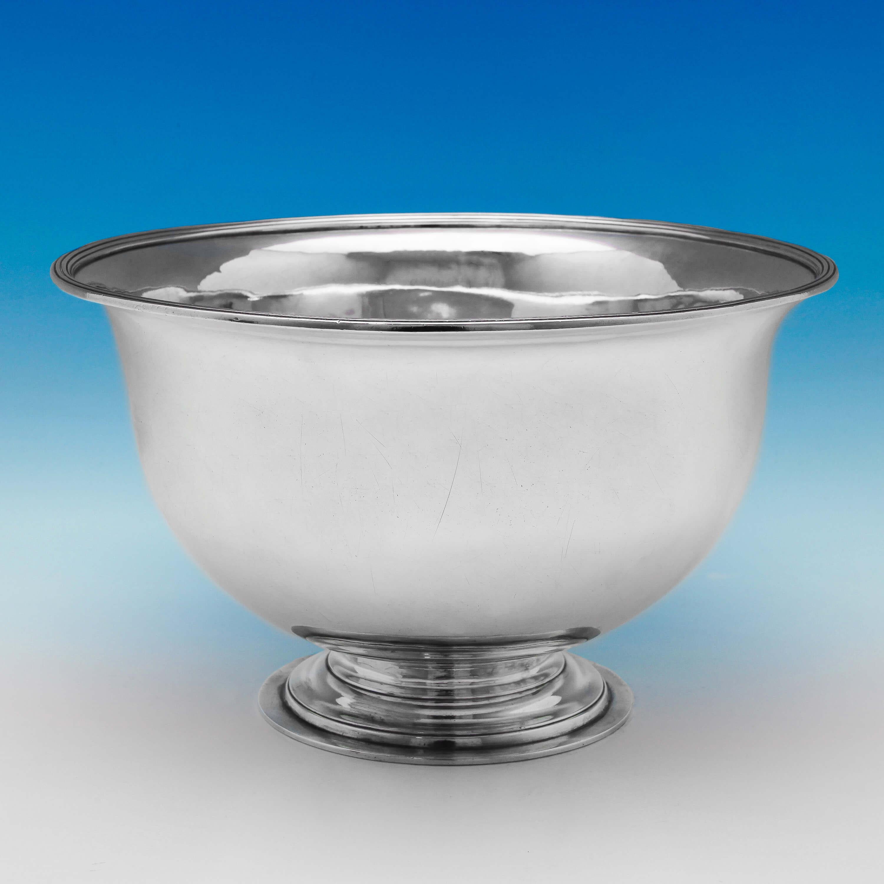 Hallmarked in London in 1798 by Paul Storr, this handsome Antique, George III, Sterling Silver Bowl is very plain in style, featuring reed borders and a pedestal foot. The bowl measures 10.5 inches (26.5cm) in diameter, 6.25 inches (16cm) tall and