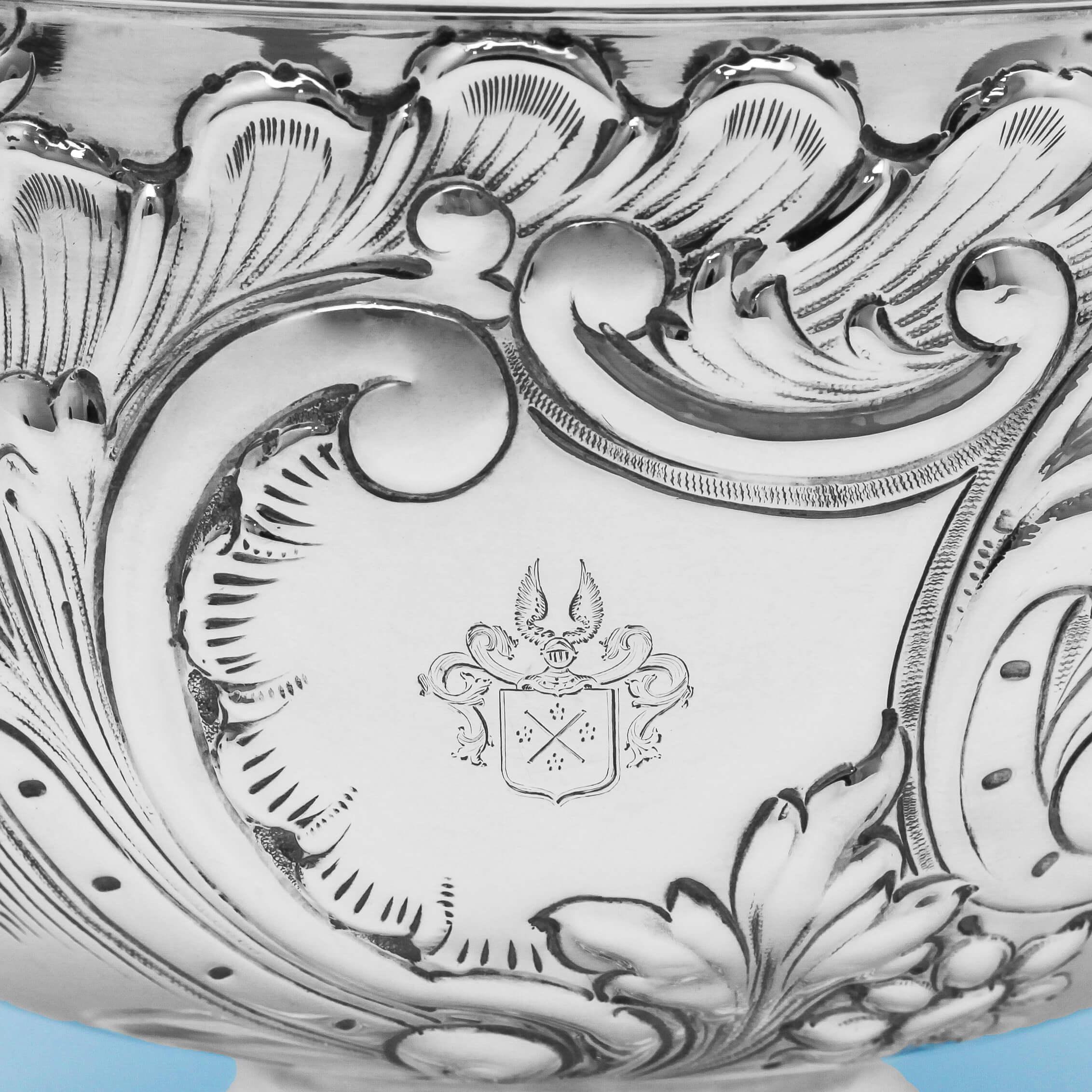 Hallmarked in London in 1897 by Fordham & Faulkner, this attractive, Antique, Victorian, Sterling Silver Bowl stands on a pedestal foot and features chased floral and scroll decoration to the body with reed borders around the foot and rim. The bowl