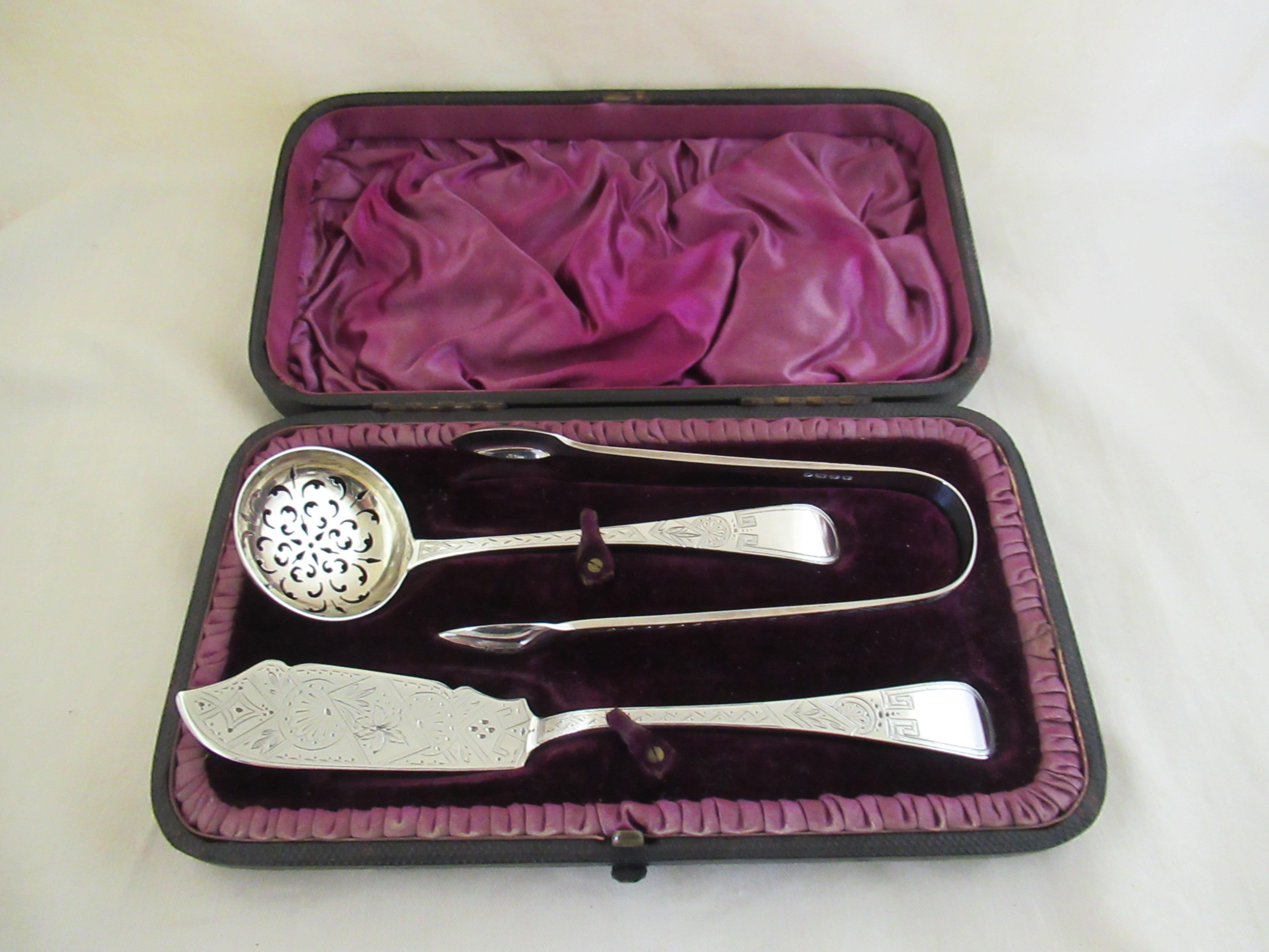 Sterling Silver - Boxed Set - Butter Knife, Sugar Tongs & Sugar Sifter Spoon.
All three pieces are identically stamped with a full English hallmark, applied by the London Assay Office:-
 Queen Victoria`s Head - Duty mark (duty has been paid to the