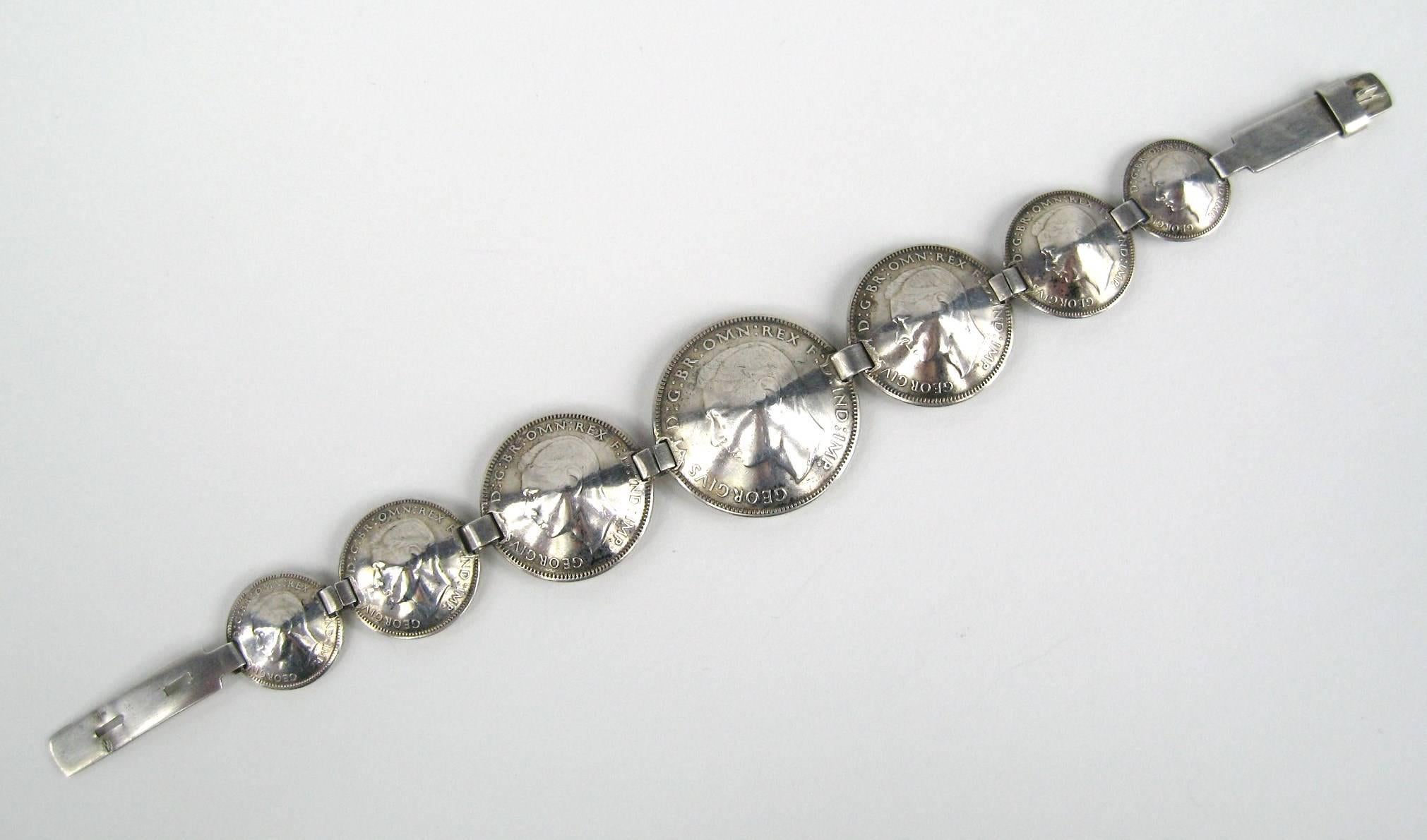 Australian Sterling silver coin bracelet. Measuring 8.25 inches. The coins measuring 1.09 inches down to .59. It has a Hand wrought closure. This will fit up to a 7