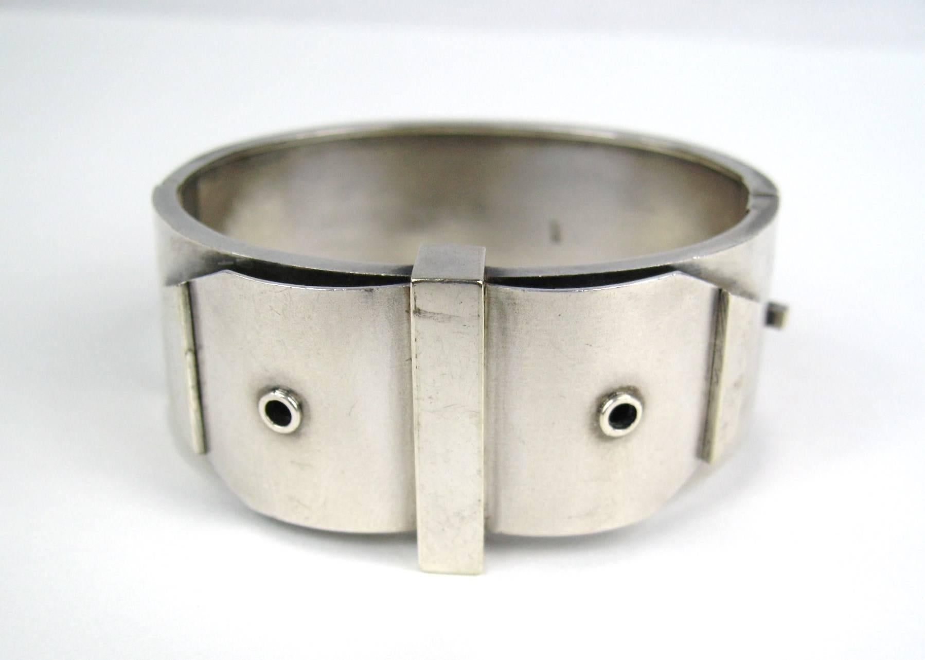 Stunning English sterling silver bracelet. Measures 1 inch wide. Will fit a 6.5  to 7.5 wrist. Slide-in clasp, as well as safety chain, still attached. Hallmarked inside the bracelet. This is out of a massive collection of Contemporary designer