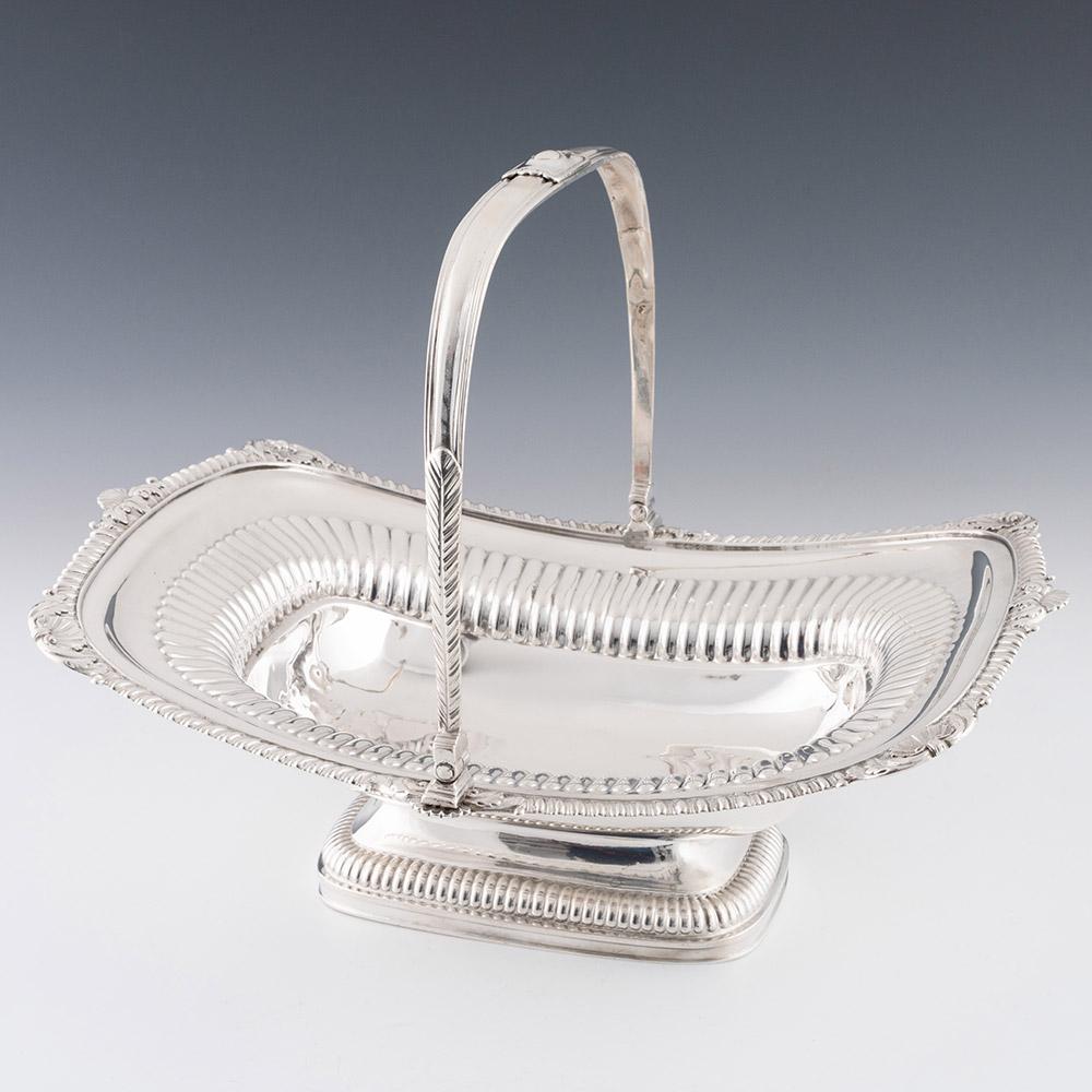 Heading : Sterling Silver Bread Basket Or cake Basket
Date : Hallmarked in London 1813 For William Stroud
Period : Regency
Origin : London England
Decoration : Boar shaped. gadrooned interior. Piecrust border with scallop shell decoration. The