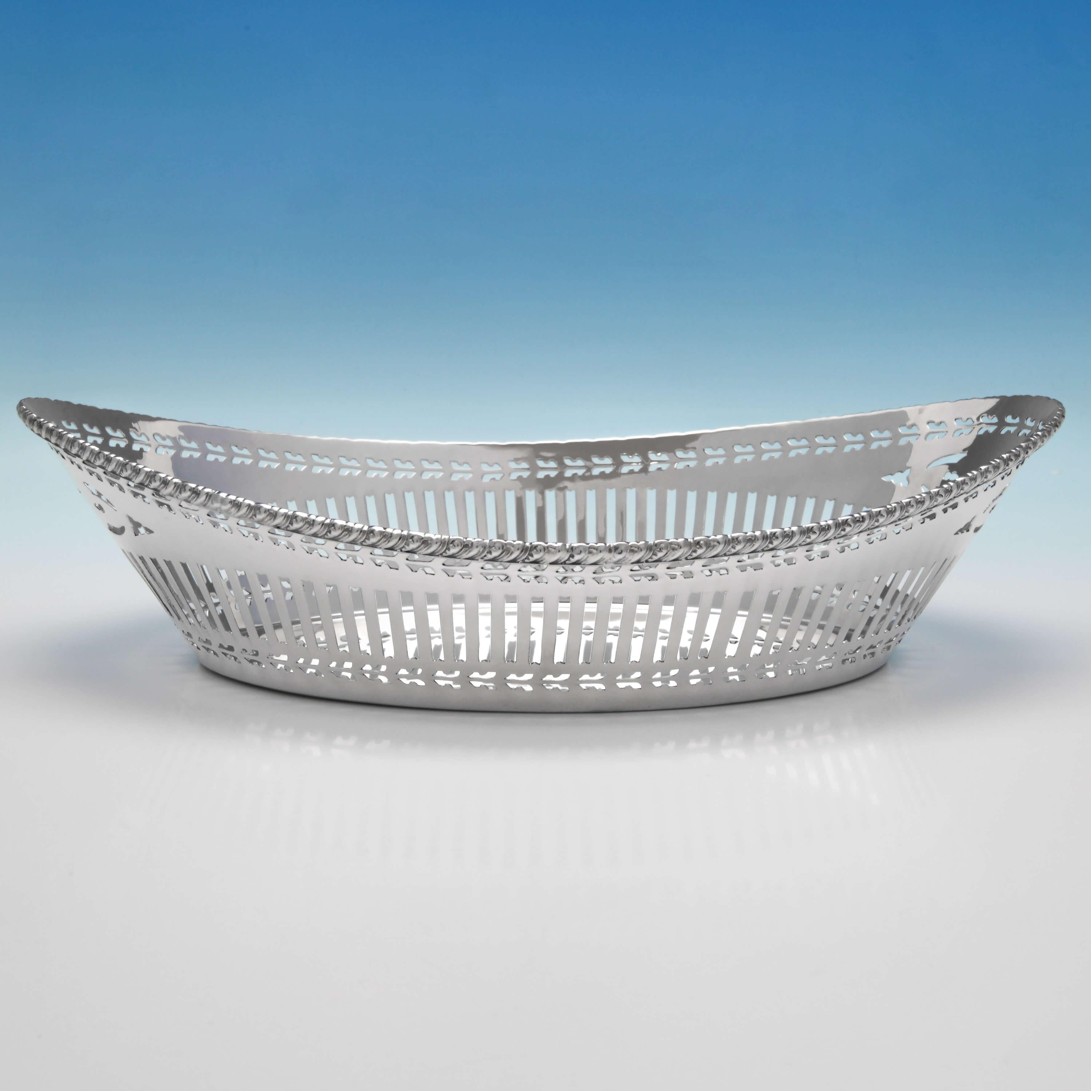 Hallmarked in Chester in 1920 by Barker Brothers Ltd., this attractive George V, sterling silver bread dish features pierced decoration to the body and an unusual gadroon and acanthus border. The dish measures: 3
