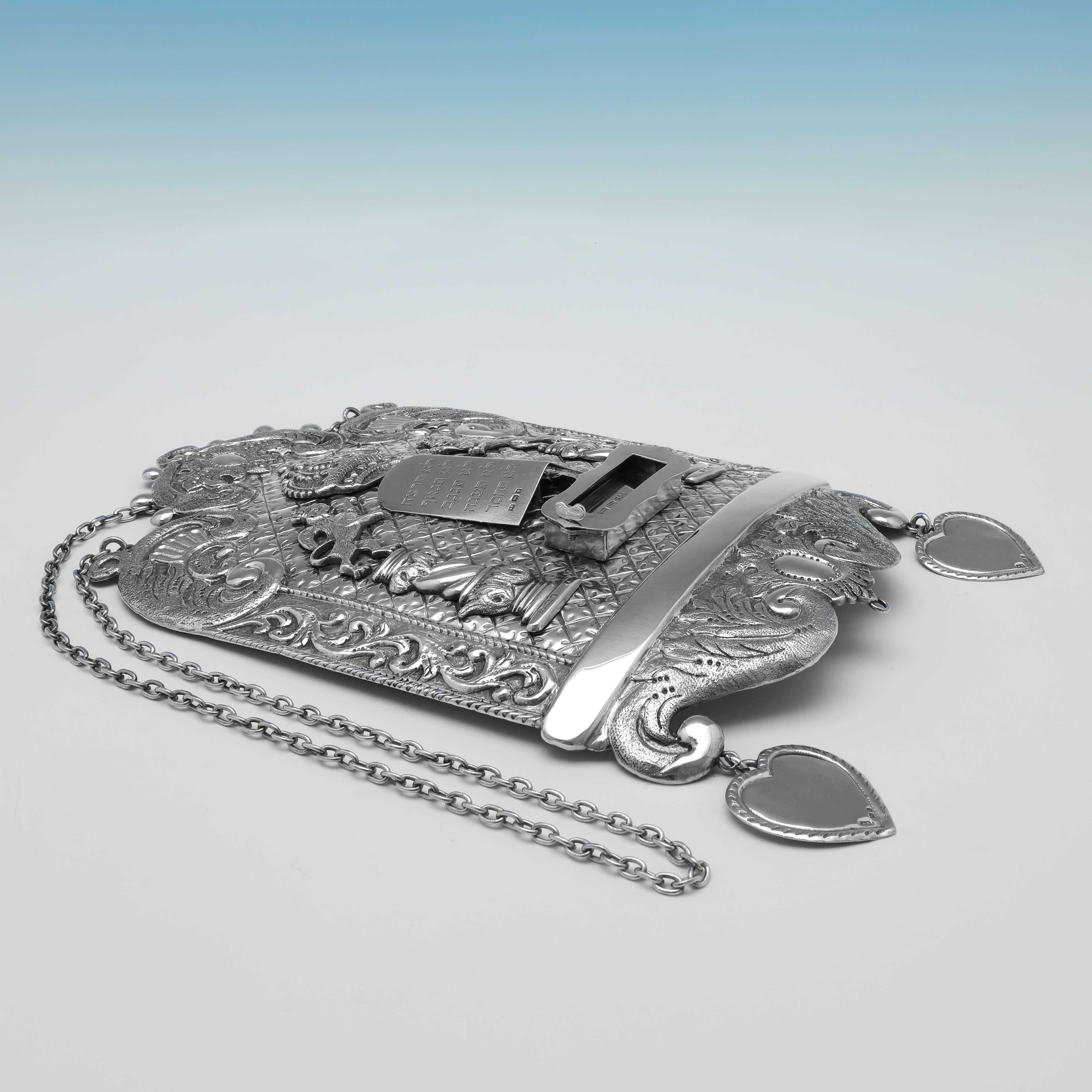 Hallmarked in London in 1922 by Arthur Bowe, this wonderfully detailed, Sterling Silver Breastplate, features decoration depiction the tablets with the engraved Ten Commandments in Hebrew, two columns representing the columns of the Temple of
