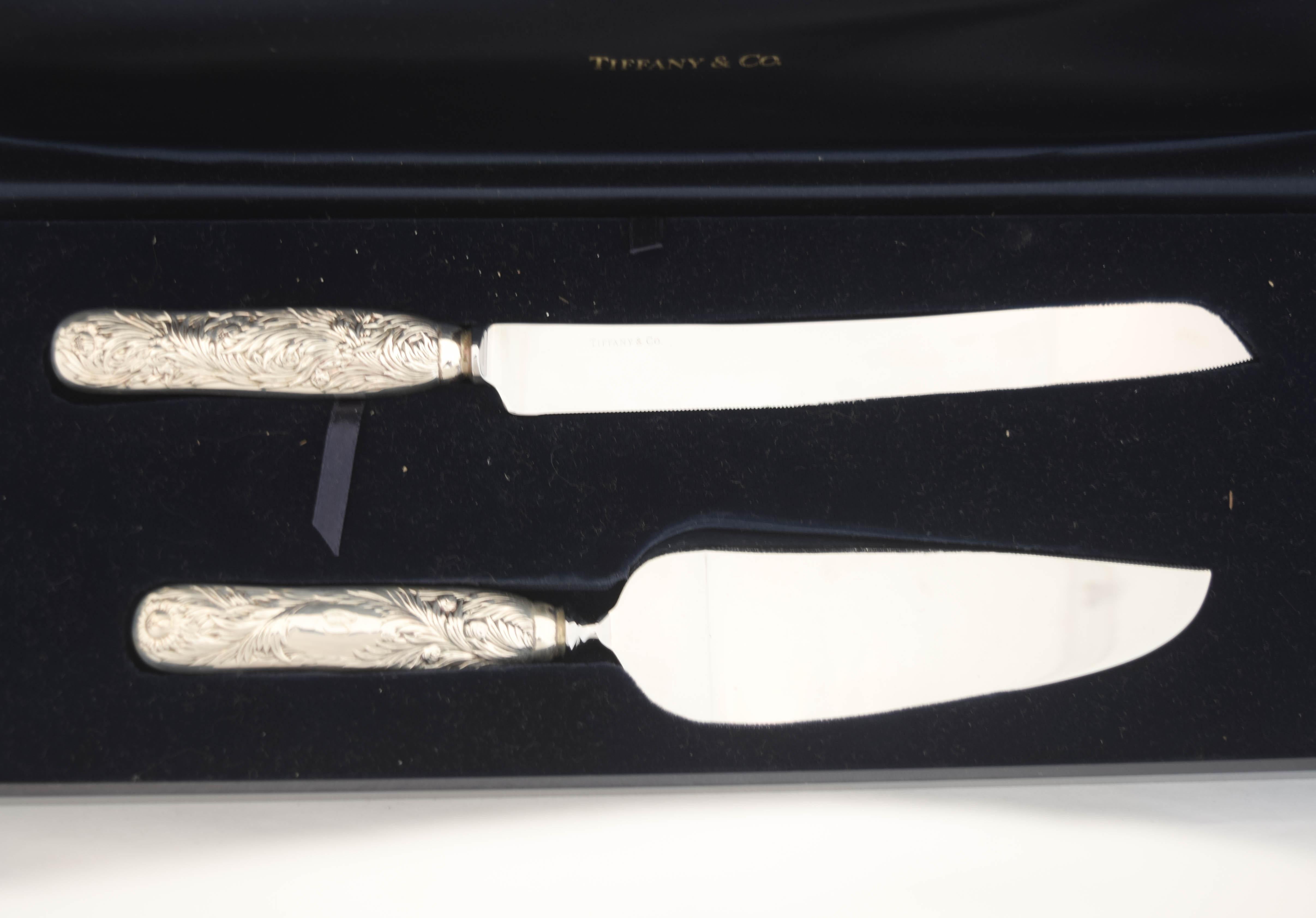 Being offered is a sterling silver Tiffany & Company cake knife and server in the original box.  This is an amazing gift for any engaged couple to use on their wedding day.  Designed in Tiffany’s iconic “Chrysanthemum” pattern, each piece fits in