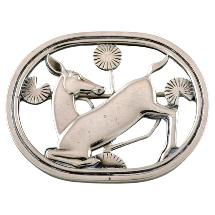 Sterling silver brooch by Georg Jensen. Design number 256. Deer motif.  For Sale