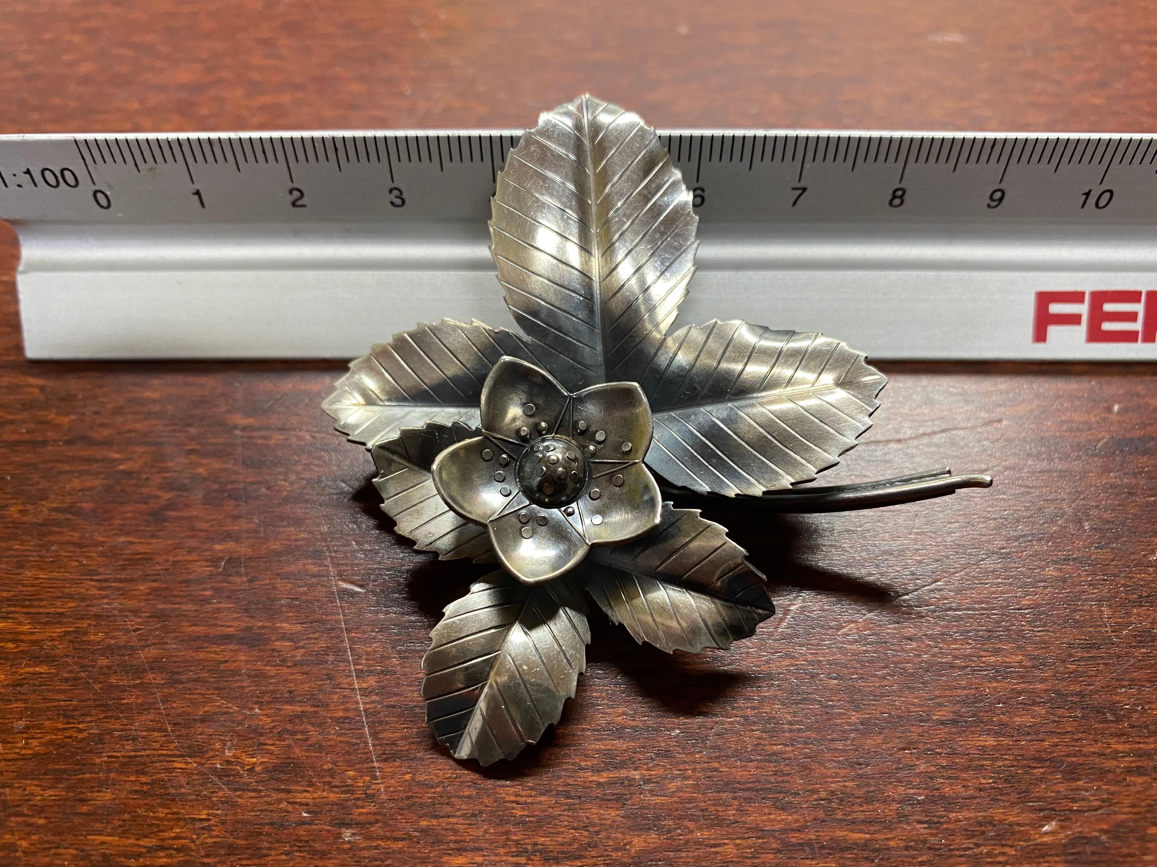  Sterling Silver Brooch from Anton Michelsen, Sweden, 1953
Exquisite Flower Jewelry.
Made in Sweden.
Lots of stamps on the back.
Wonderful detail.
Really beautiful jewelryThe flower leaves seem to have depressions at the edges, but they belong to