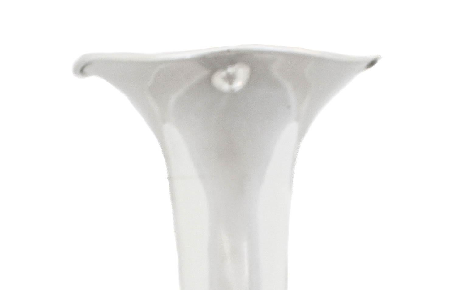 We are happy to offer you this sterling silver bud vase from the early 20th century. Manufactured & signed by “Geo. L. Vose Company of Providence, Rhode Island. It’s sleek and contemporary with a scalloped rim. There’s a hand engraved Old English