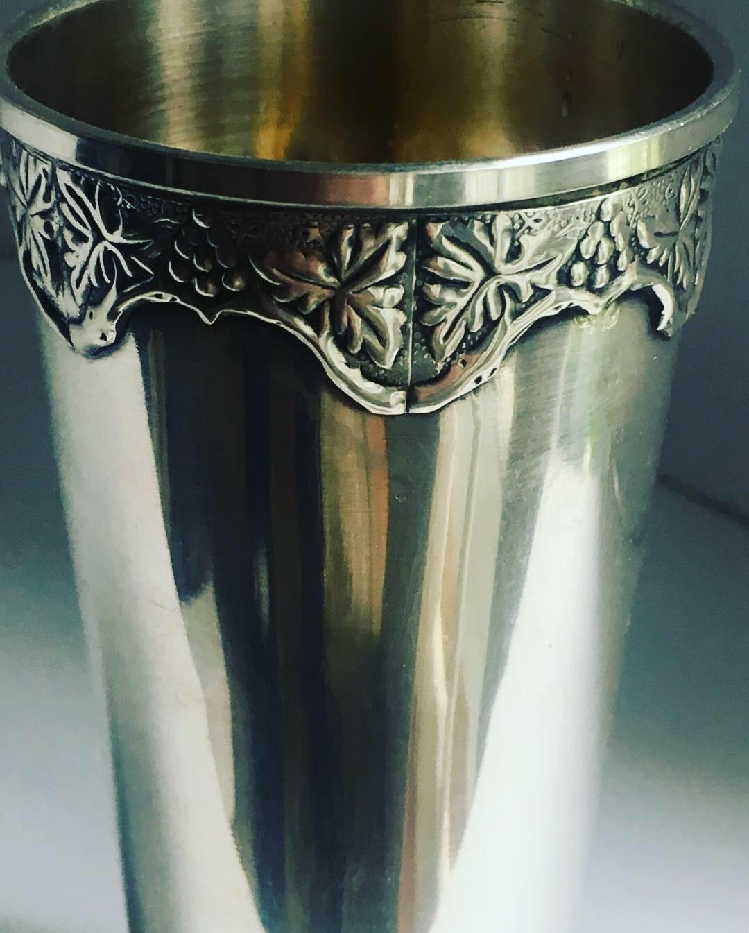 Sterling silver bud vase - simple and sophisticated with a floral border along the top edge... this piece is a handsome compliment to any desk table.