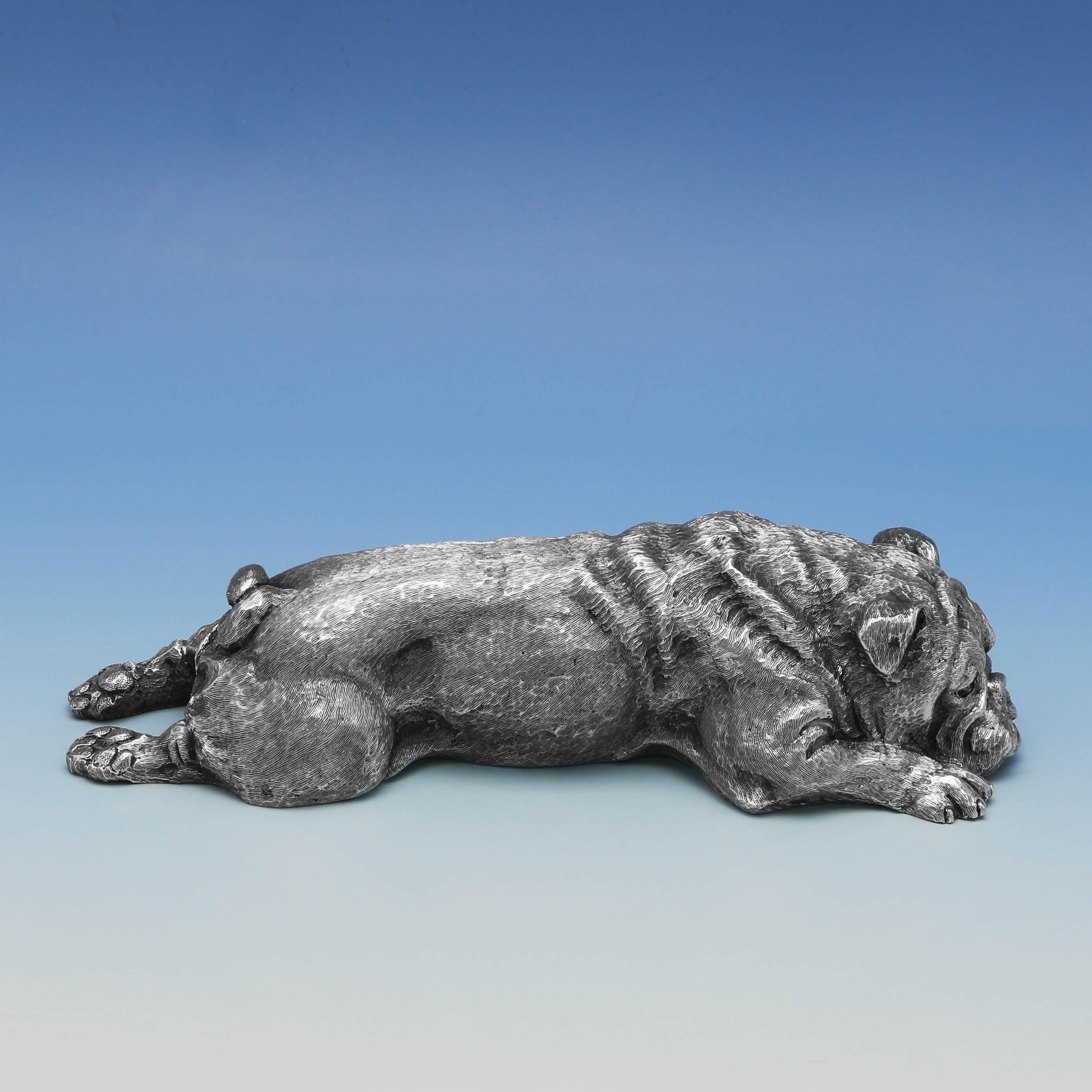 Hallmarked in London in 1976, this wonderful, sterling silver model of a bulldog, is exquisitely cast and hand finished in a recumbent position, showing a very high level of detail. The bulldog measures 1.5