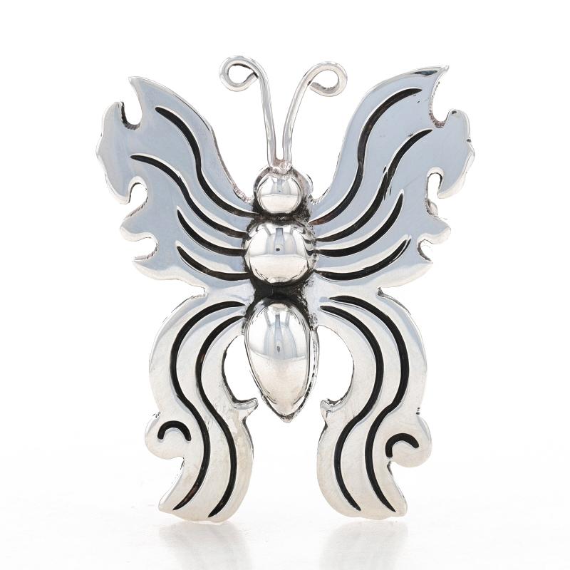 Metal Content: Sterling Silver

Style: Brooch
Fastening Type: Hinged Pin and Whale Tail Clasp
Theme: Butterfly, Nature

Measurements

Tall: 1 21/32
