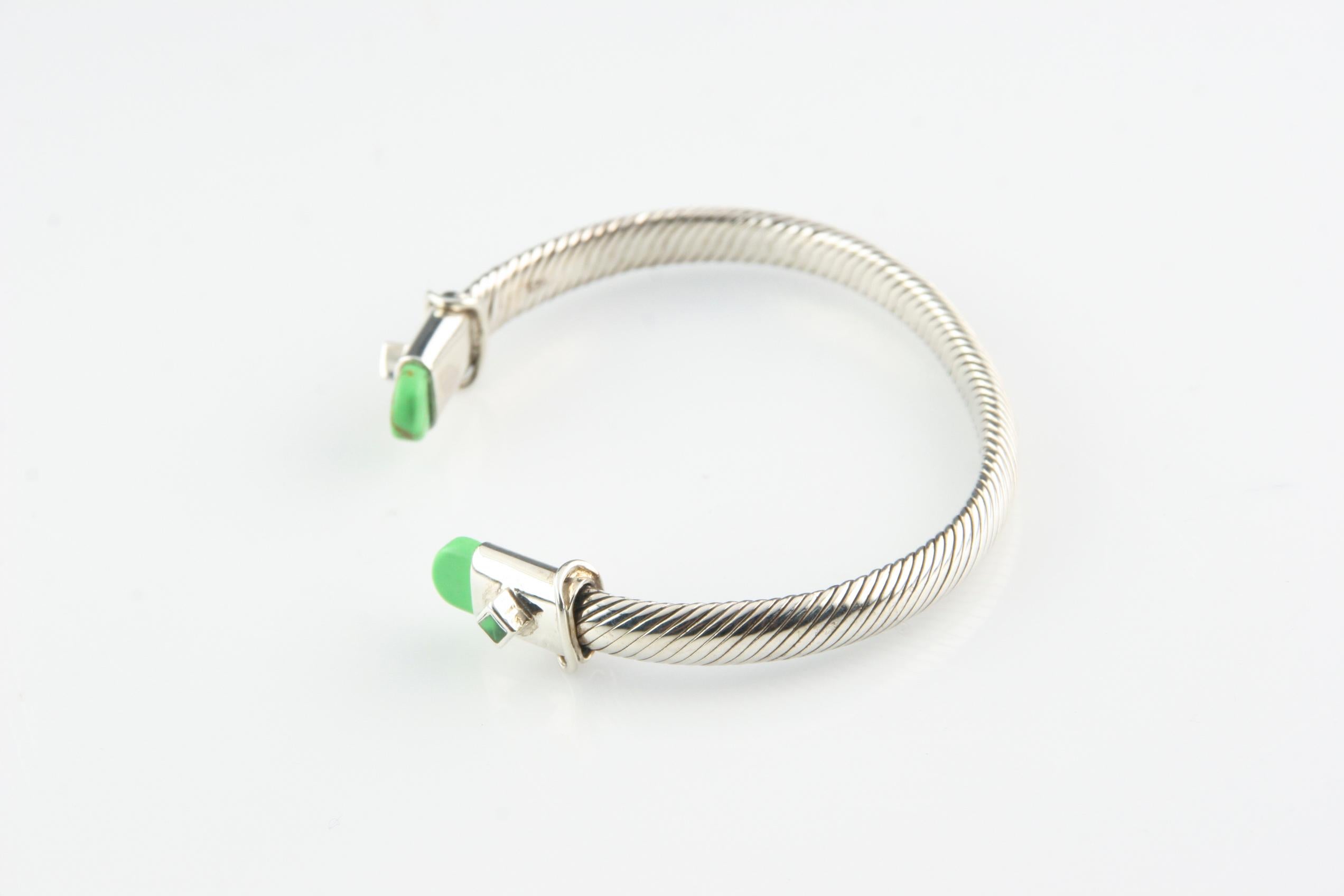 Gorgeous sterling silver cable cuff bracelet.
Ends of bracelet are capped in green.
Wrist Fit: 7 inches.
Outer Circumference: 8.25 inches.
Width: 6 mm.
Weight: 28.7 grams.
An amazing gift for your loved one!