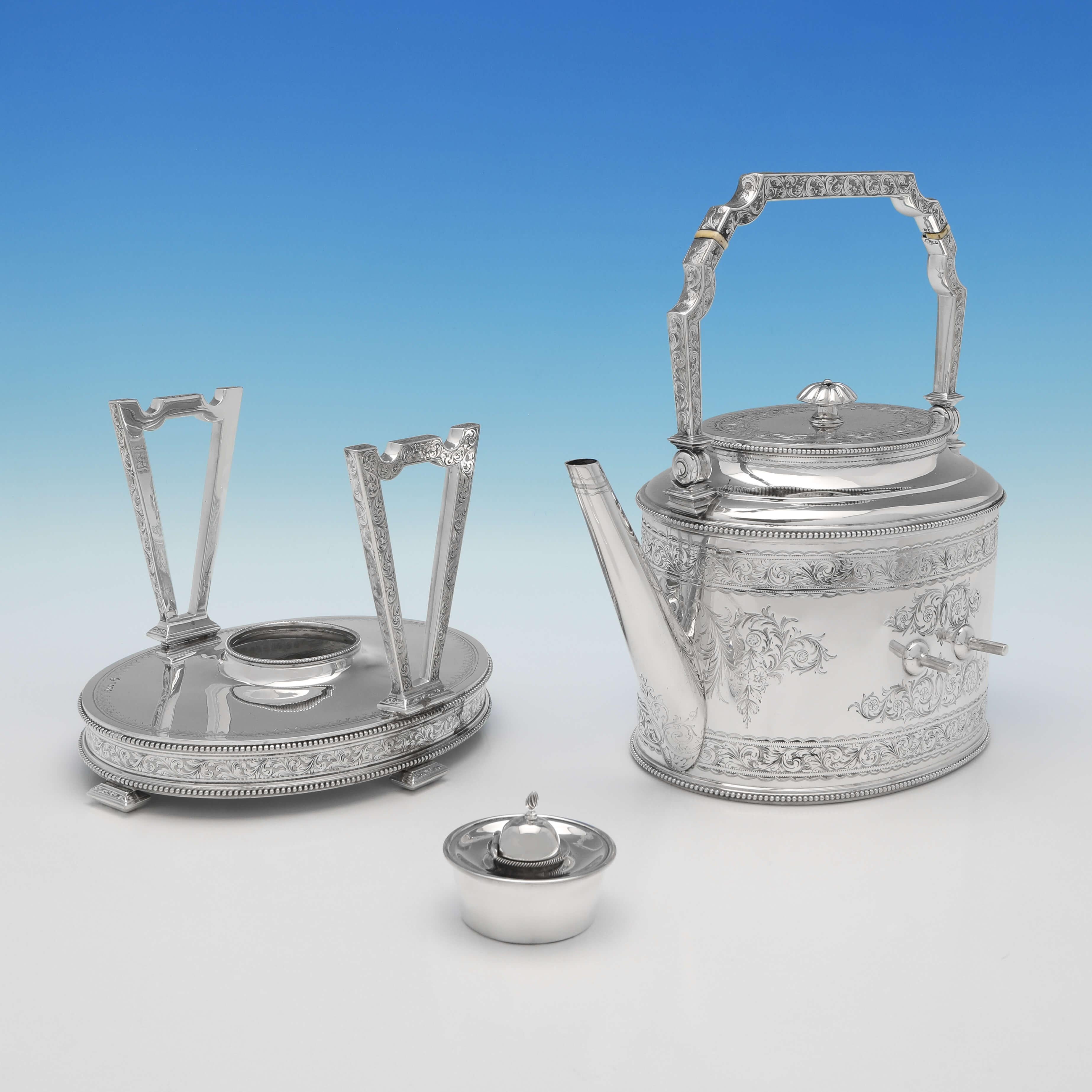 Hallmarked in London in 1870 by John Kilpatrick (over stamping Elkington most likely), this very attractive, Victorian, Antique Sterling Silver Kettle, is in the 'Can Shape' and features engraved decoration throughout. The kettle measures