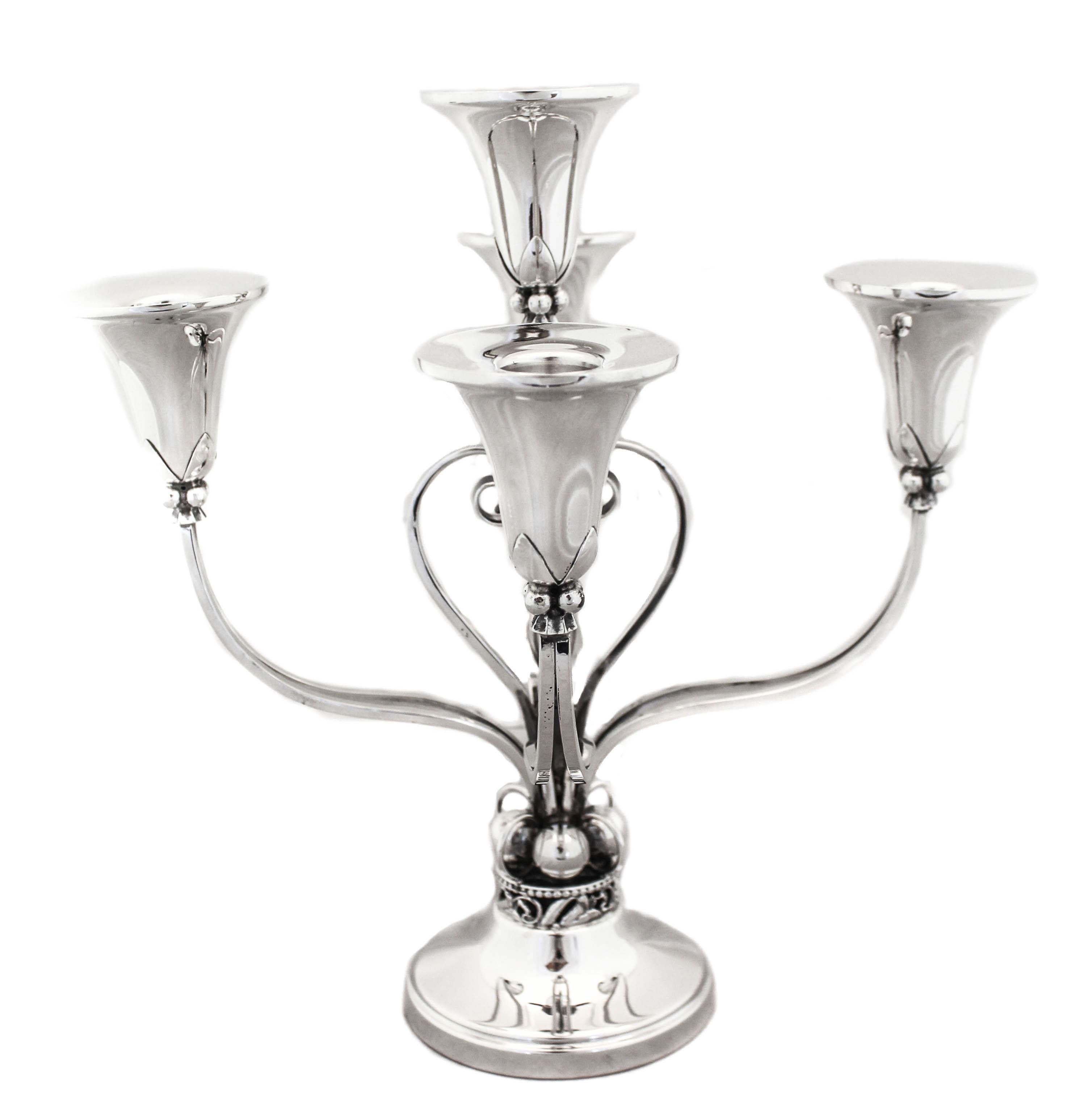 A magnificent five-branch sterling silver candelabra with a Jensenesque Art Deco style. It has a great shape and design and really stands-out.