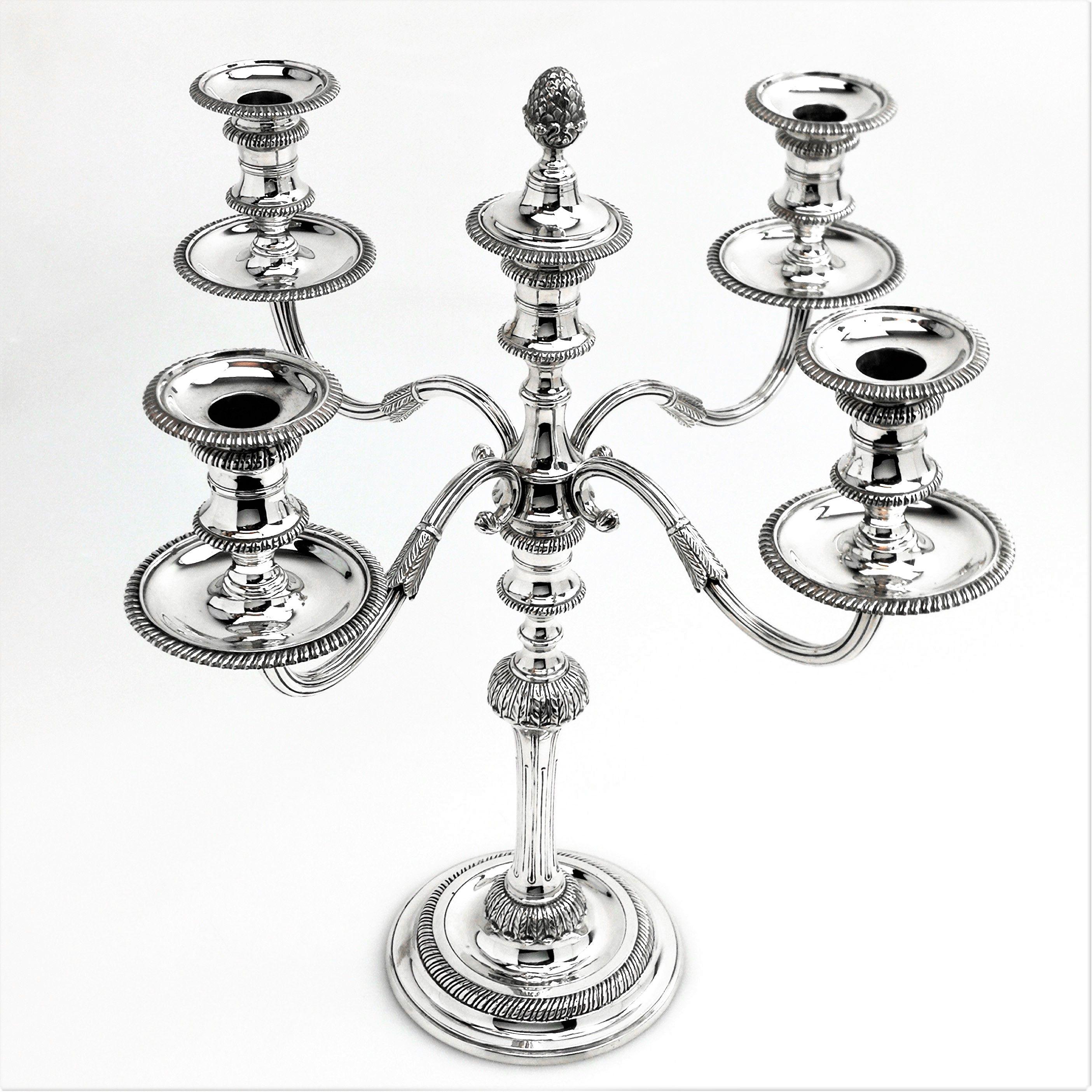 A vintage sterling silver 5-light Candelabra embellished with a traditional Gadroon pattern on the round spread foot and on the capitals and sconces. The Candelabra has a cast silver circular spread foot base and removable branches allowing it to be