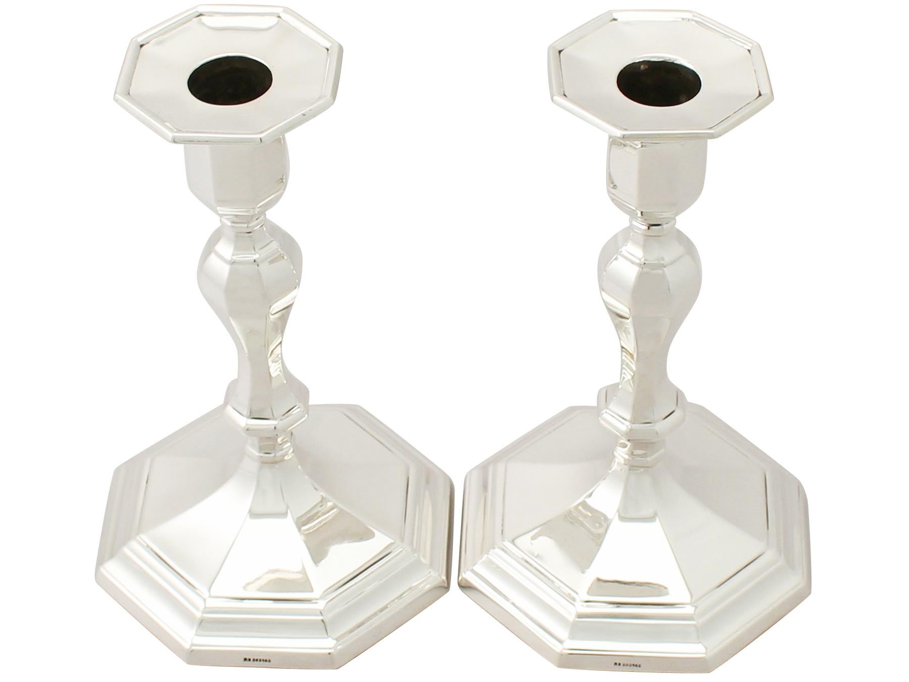 An exceptional, fine and impressive pair of antique Edwardian English sterling silver candlesticks; an addition to our Edwardian silverware collection.

These exceptional antique Edwardian sterling silver candlesticks have a plain octagonal form