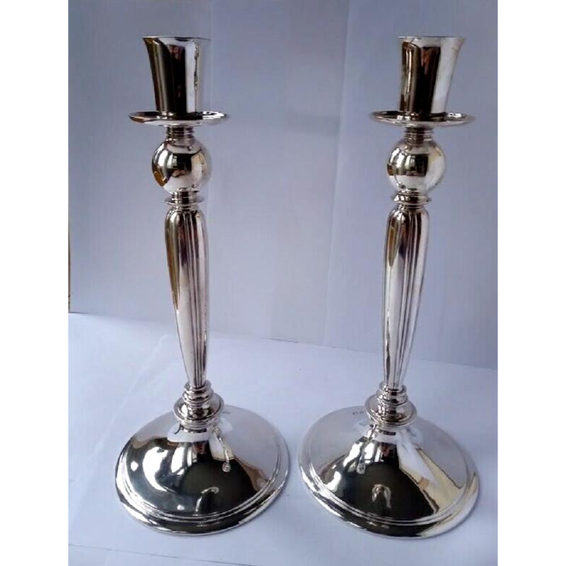 This fine pair of silver candlesticks are in excellent vintage condition. They have been polished and are very clean. They are signed by Harold Stabler, the bases are not filled. Hallmarked: Boodle & Dunthorne, Liverpool. RD No 800198.

Made by
