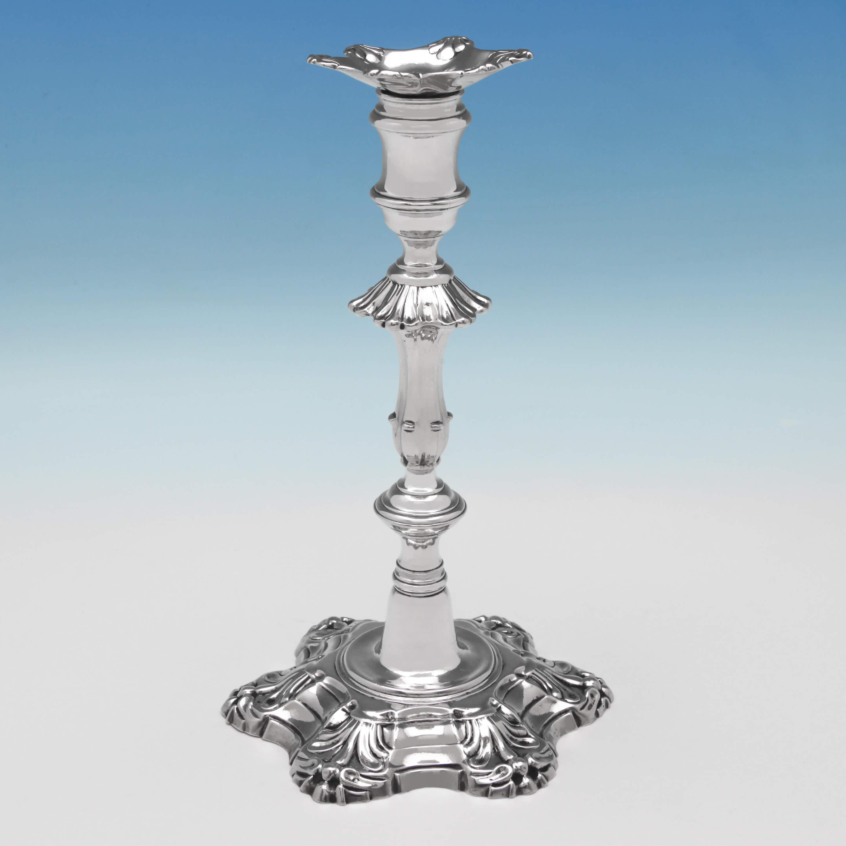 Hallmarked in London in 1756 by J. Priest, this magnificent pair of George II, antique, sterling silver candlesticks, are in the 