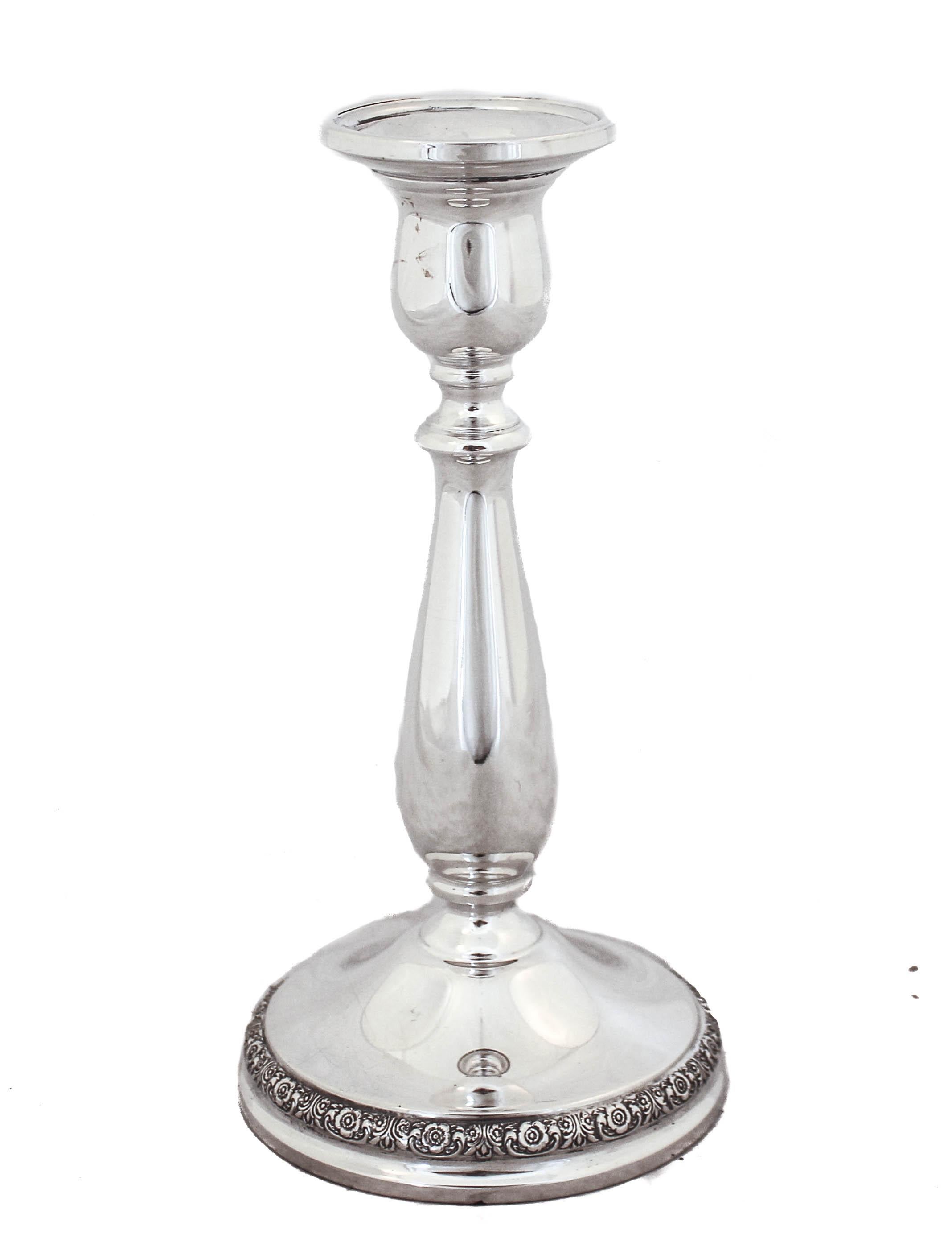 These sterling silver candlesticks are being offered. They are made by International Silver and are from 1939. They have a floral motif around the base the rest is clean and simple. These beauties can fit in any decor and are timeless!