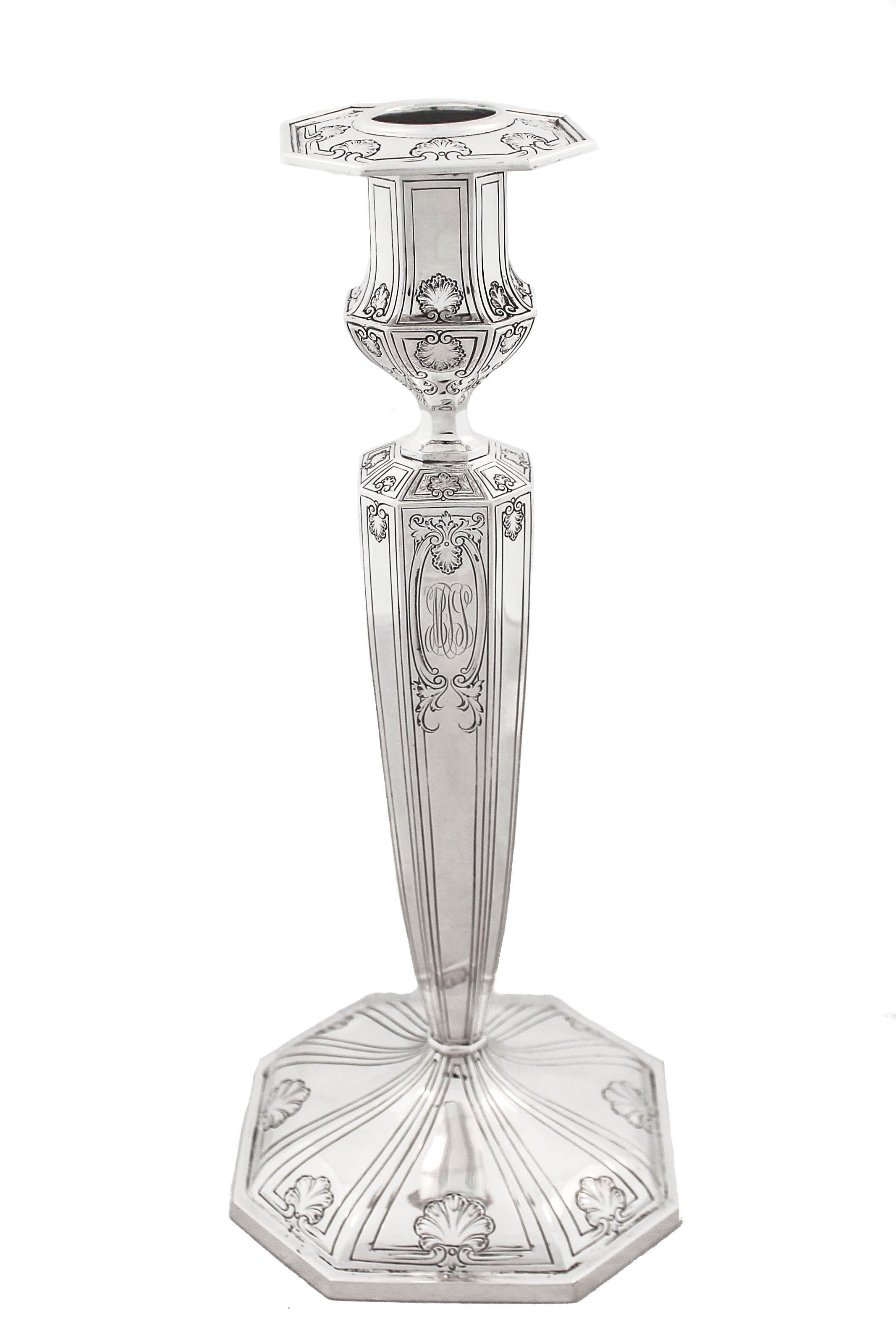 Being offered is an exceptionally tall and beautiful pair of candlesticks by Dominick and Haff of New York.
They have an etched motif throughout the base, body and top; a fan shaped design and leaves decorate each corner.  The base is octagonal and