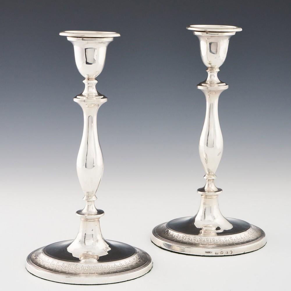 Heading : Sterling Silver Candlesticks
Date : Hallmarked in Sheffield 1796 For John Younge
Period : George III
Origin : Sheffield, Yorkshire, England
Decoration : True baluster stems. The perimeter of the ovoid feet decorated with braided swags