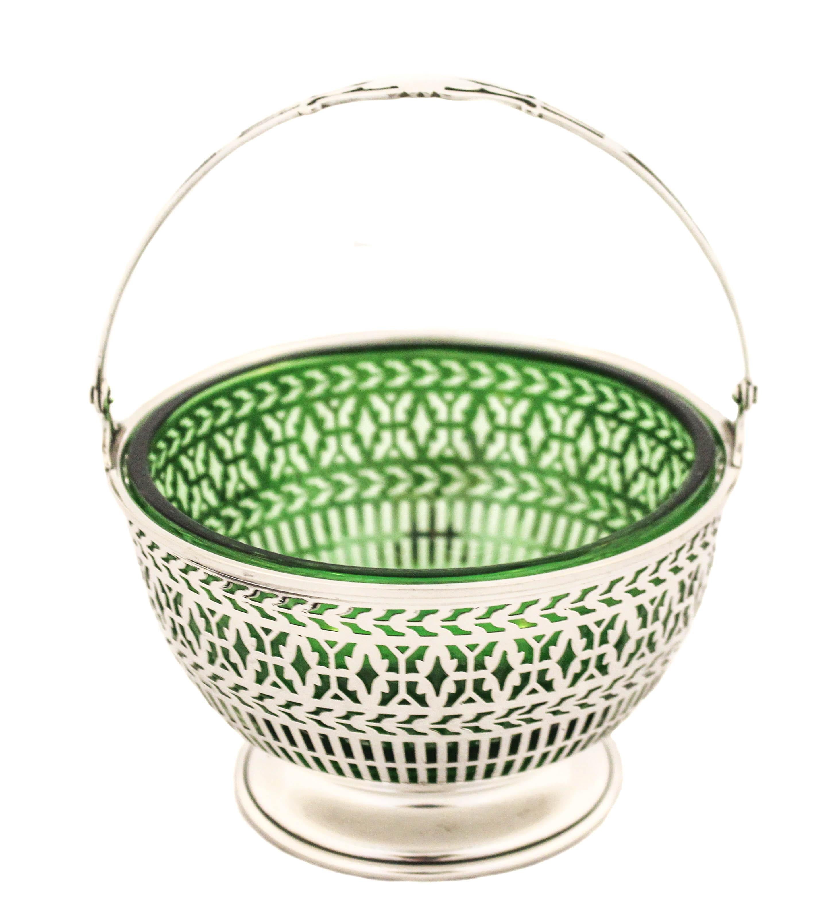 This sterling silver basket with a green liner is being offered. It has a reticulated design that lets the green liner show through. Green is such a beautiful color and definitely adds life to any room or decor. The handle folds down for easy