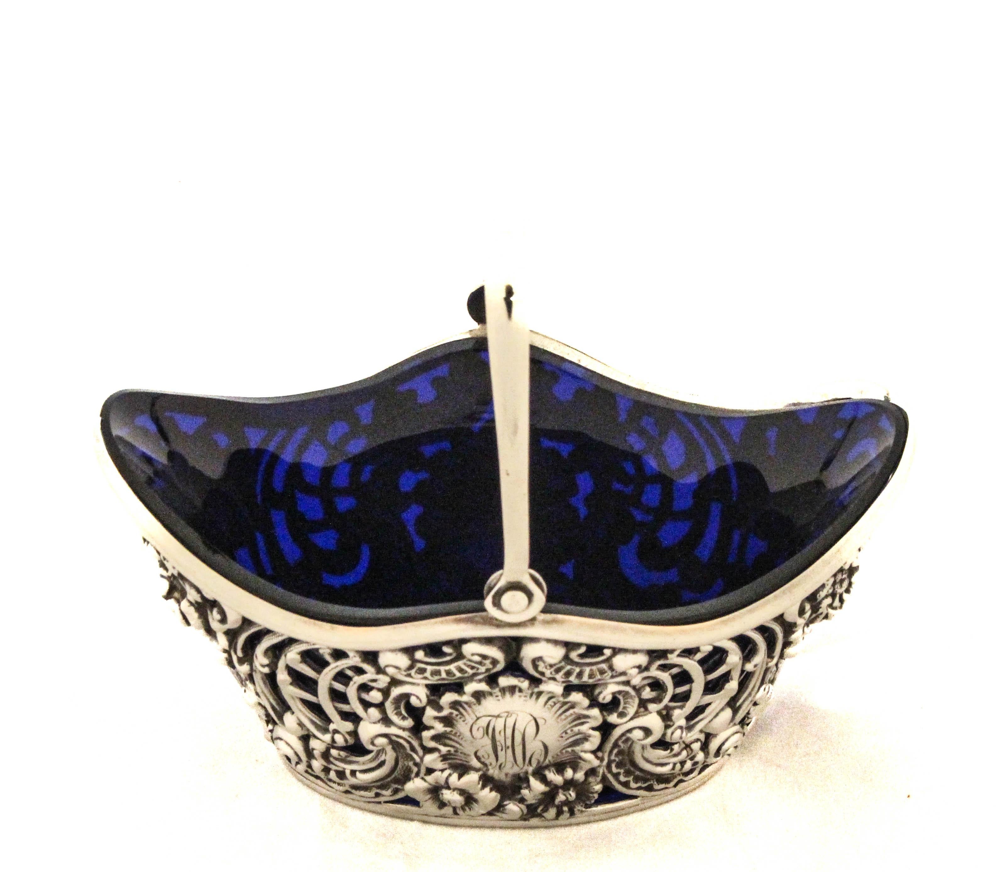 An exquisite sterling silver reticulated candy basket by Dominick & Haff, dating to the late 1880s. This ornate piece is a striking example of late 19th-century American silver craftsmanship, featuring an intricate openwork design that surrounds all