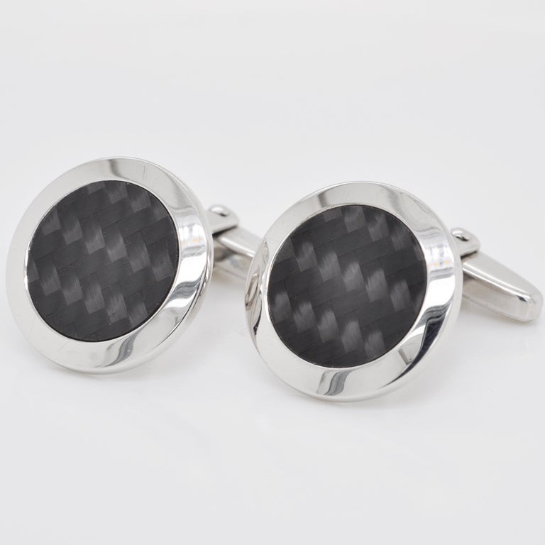 Made from Sterling Silver, these cufflinks are the perfect mix of contemporary style while being simple and classic. These round shaped vintage cufflinks feature stunning black guilloché enamel with dynamic patterns under the enamel. The patterns
