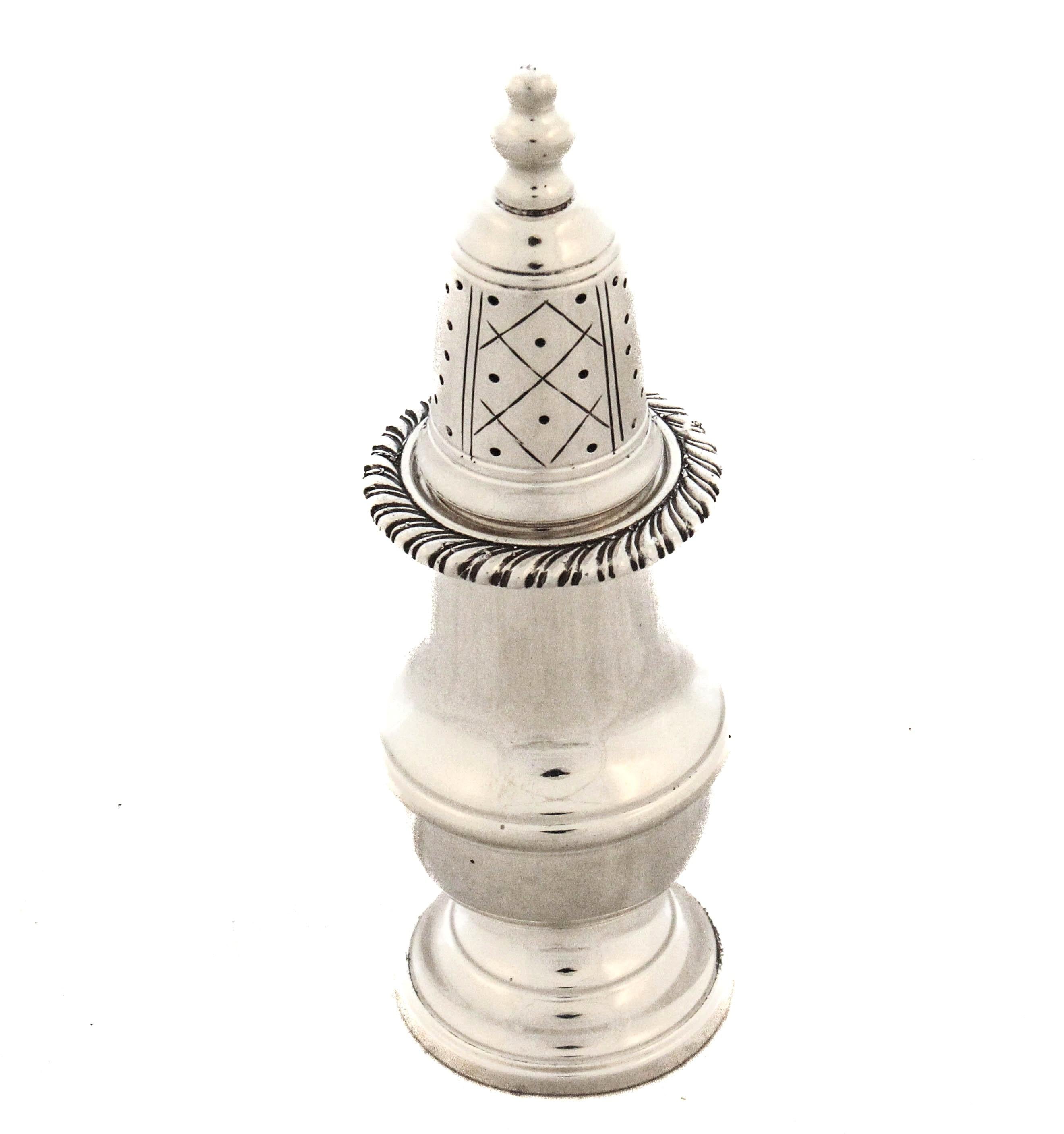 A beautifully crafted sterling silver master salt shaker by Cartier, signed clearly on the underside with the prestigious maker’s mark. The shaker features a classic, timeless silhouette with a bold gadroon design encircling the upper portion just