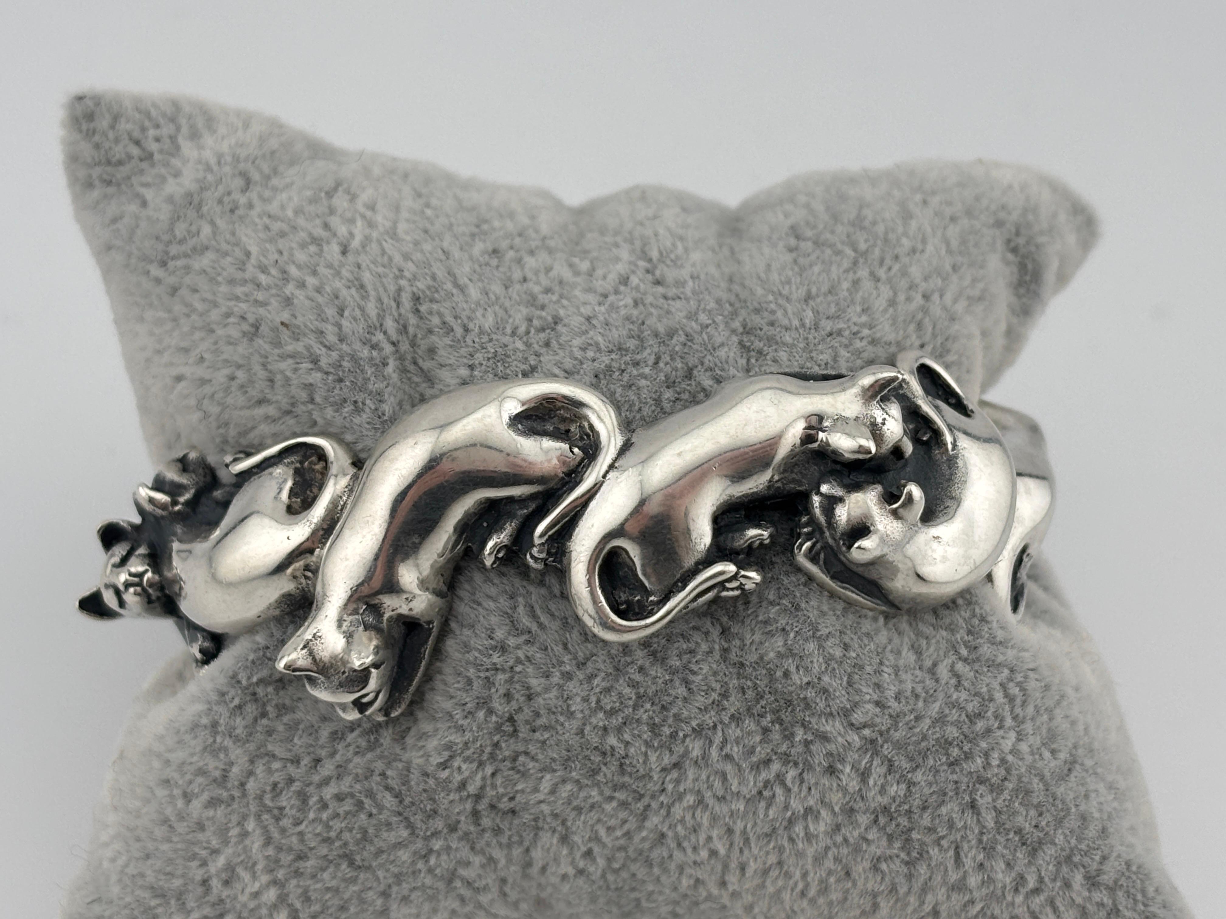 Material: Sterling Silver
Weight: 74.2 grams
Size: 6.25 inches

Beautiful bracelet for any cat lover!
