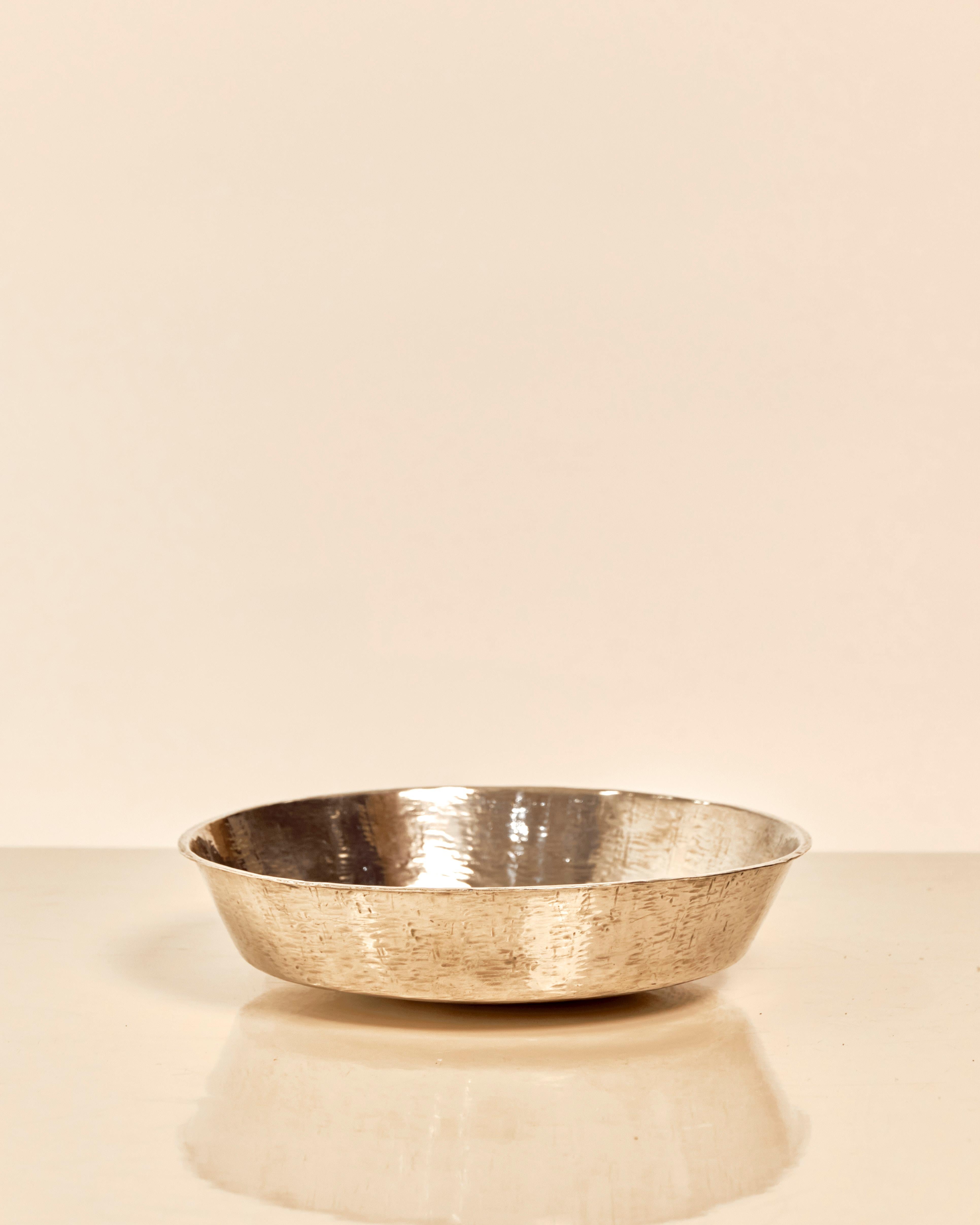 Hammered Sterling Silver Bowl by Tapio Wirkkala (1915 - 1985). Wirkkala was an iconic post war designer whose Finnish designs are still as influential today. The bowl has a hammered suface with 