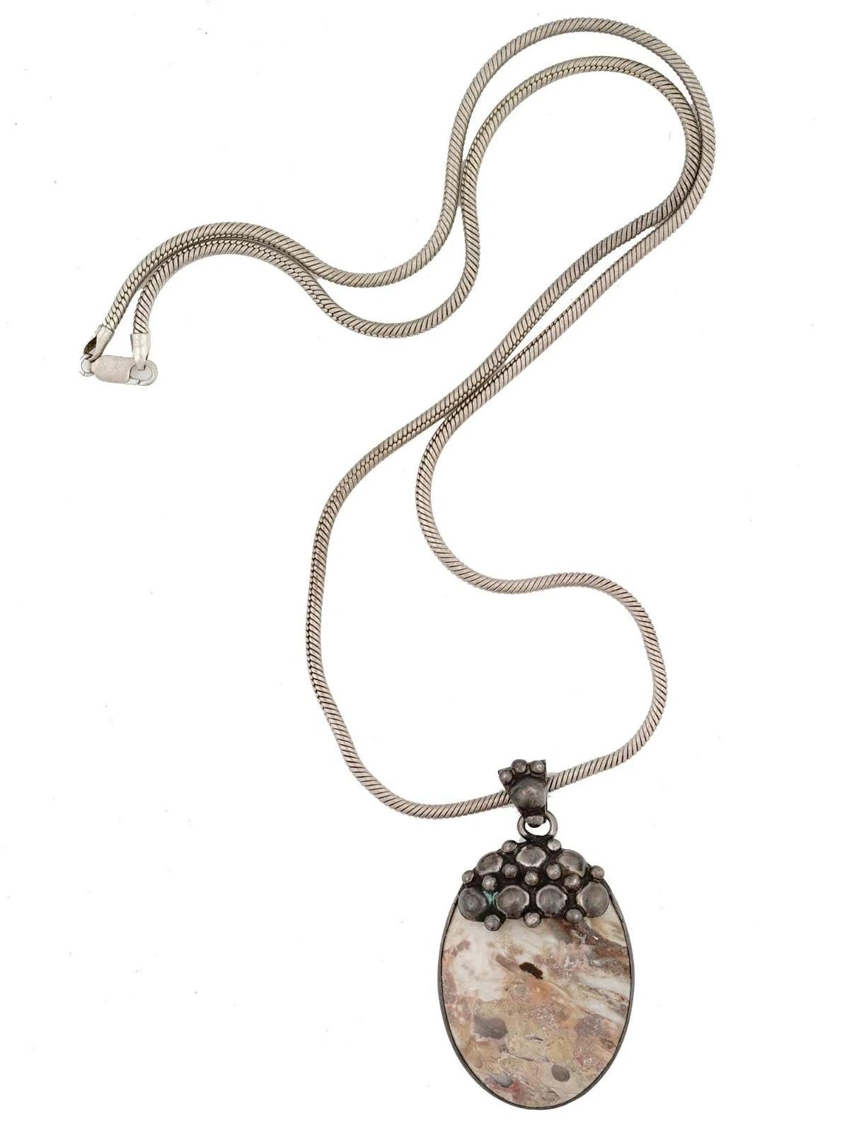 A vintage sterling silver snake chain necklace of opera length with a polished oval jasper stone medallion. Marked Italy, 925 on the clasp. Total Weight: 75 grams. Statement Jewelry For Women, Silverware.
Dimensions: Pendant 2 5/8 x 1 3/8 in,