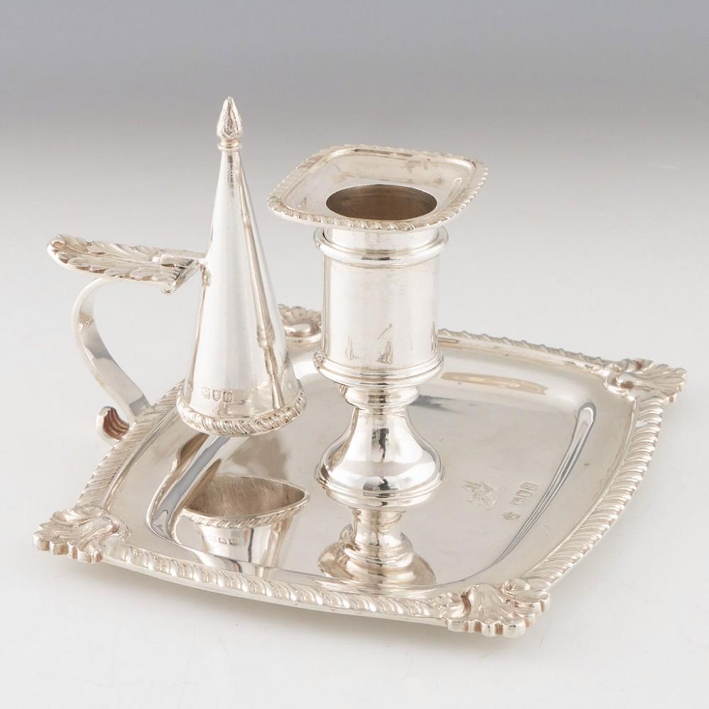 Heading : Sterling silver chamberstick
Date : Hallmarked in London in 1898 for William Hutton & Sons
Period : Victoria
Origin : London, England
Decoration : Pie crust rims with cast fan decoration to the corner. Pie crust sconce. Acanthus leaf thumb