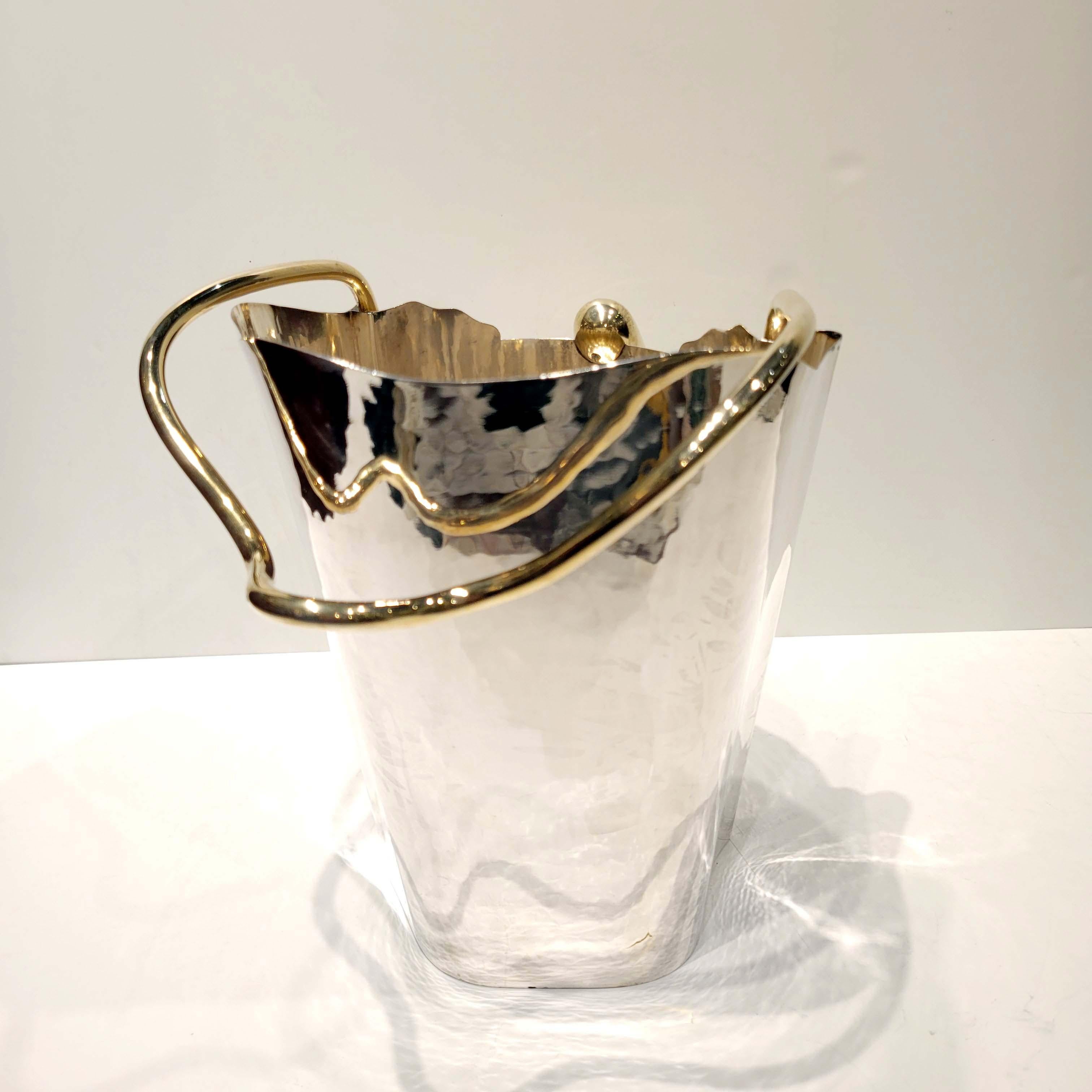 Sterling silver, partly gold plated ice/ champagne bucket Designed by Borek Sipek for Cleto Munari. Edition: 8/99. Hand hammered sterling silver . Approximate weight, 48 Troy Ounces. 
Biography. Boris Sipek was born in Prague, Czechoslovakia in