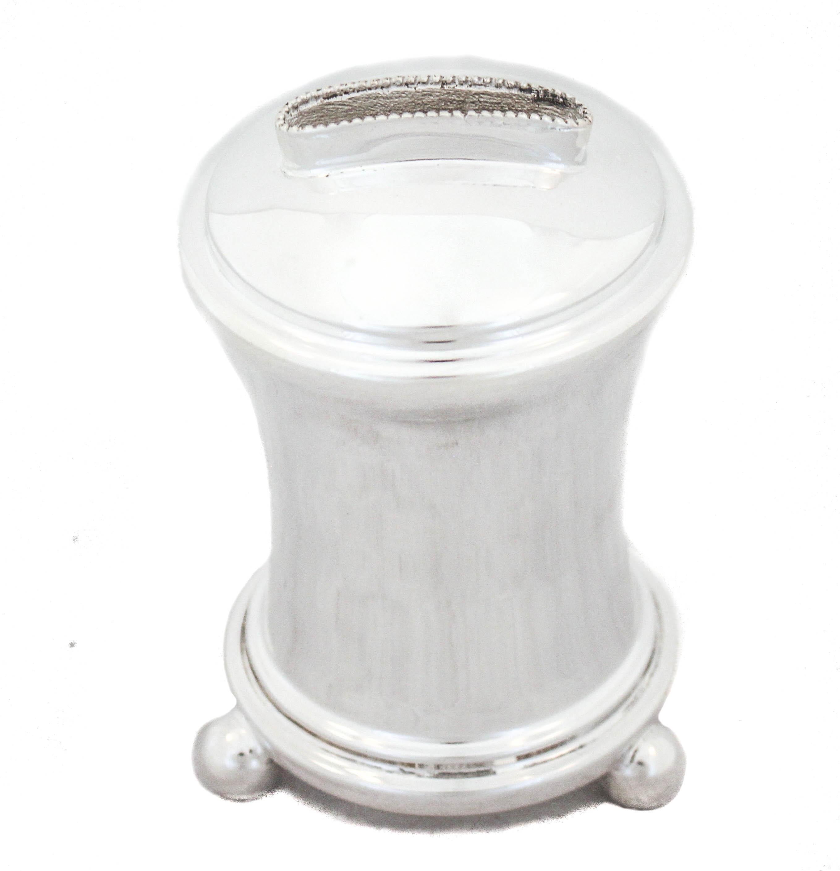 Being offered is a sterling silver charity (Tzedakah) box.  Sleek and contemporary it is elegant and timeless.  It stands on three round balls and has a slightly curved shape.   Charity is a basic tenant in all religions so a charity box could be