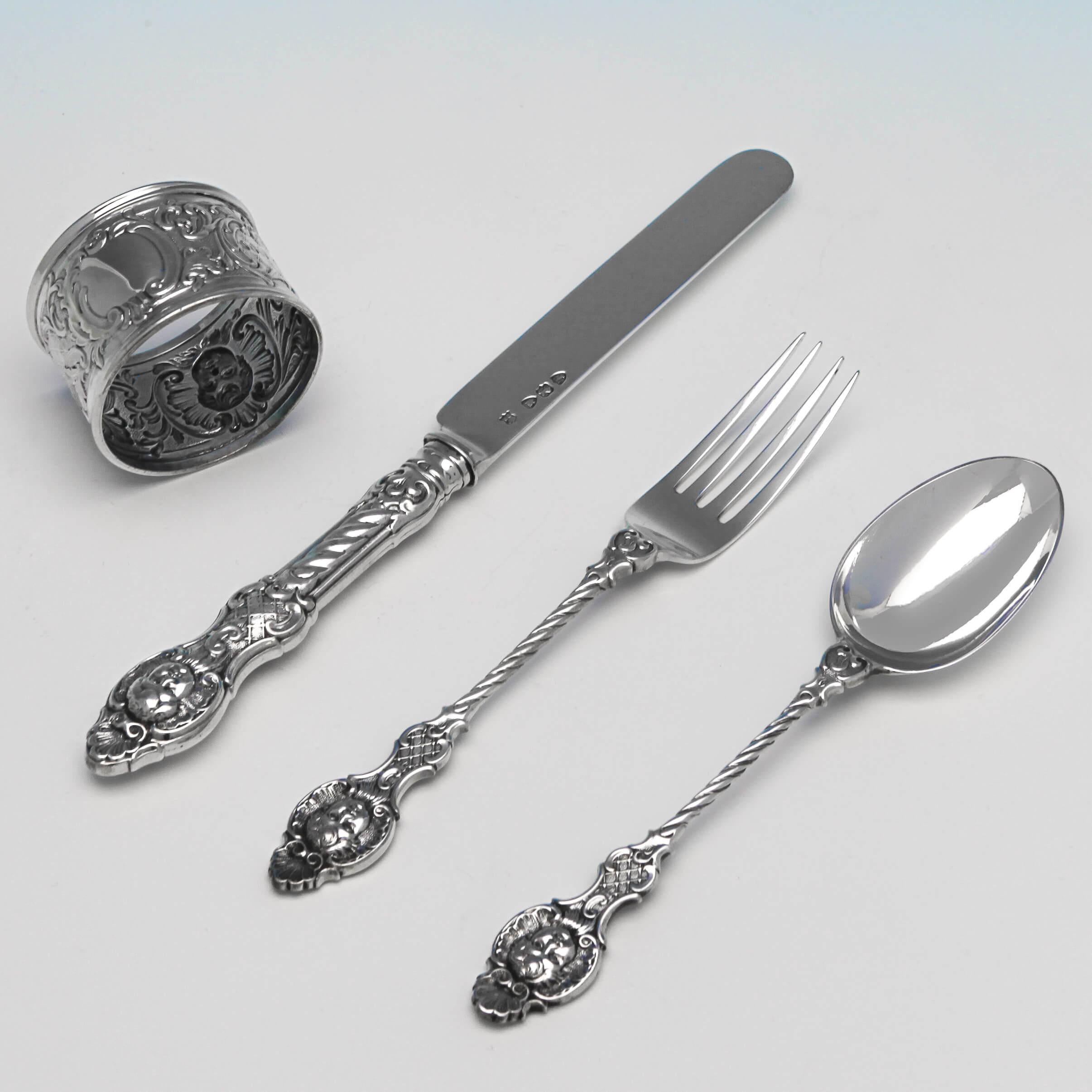 Hallmarked in London in 1894 by Gibson & Langman, this eye-catching, Antique, Victorian, Sterling Silver Child's Set is presented in its original fitted box. The flatware has highly decorative handles with shell topped cherubic masks. The knife and