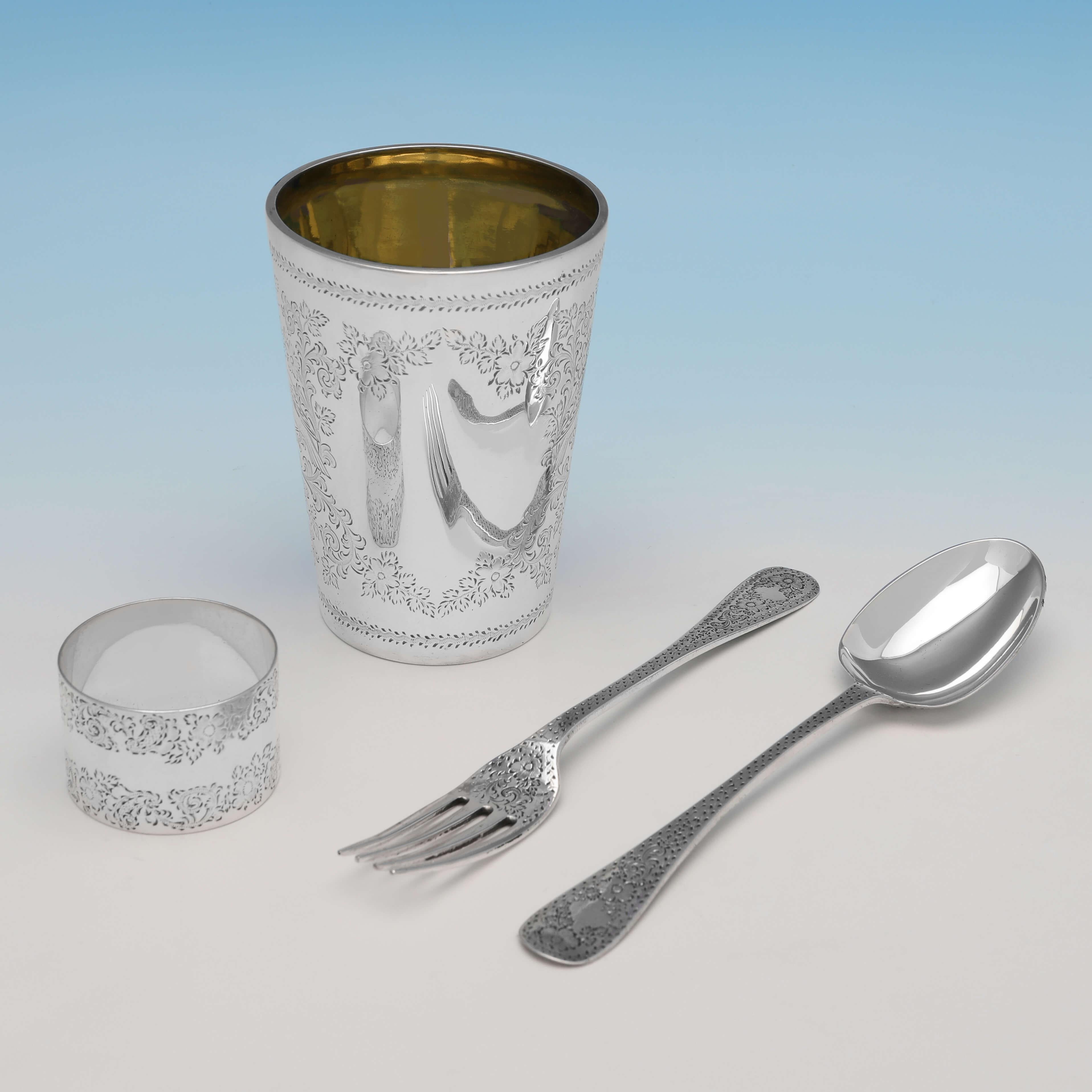 Hallmarked in London in 1890 (the napkin ring hallmarked in 1900) by Wakely & Wheeler, this very attractive, Victorian, Antique Sterling Silver Childs Set, comprises of a beaker, napkin ring, spoon and fork, all featuring Aesthetic engraved